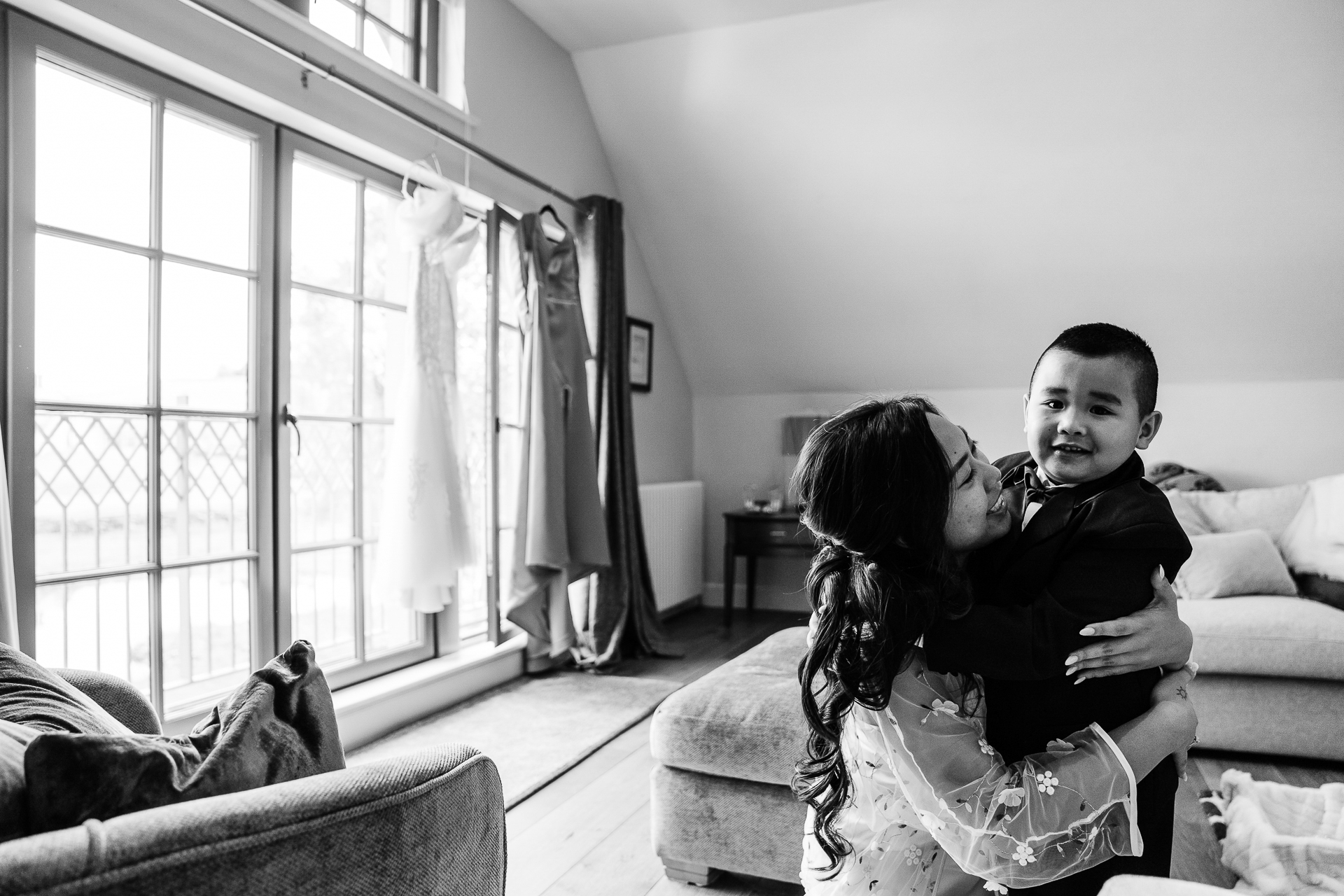 A person and a child sitting on a couch in a room