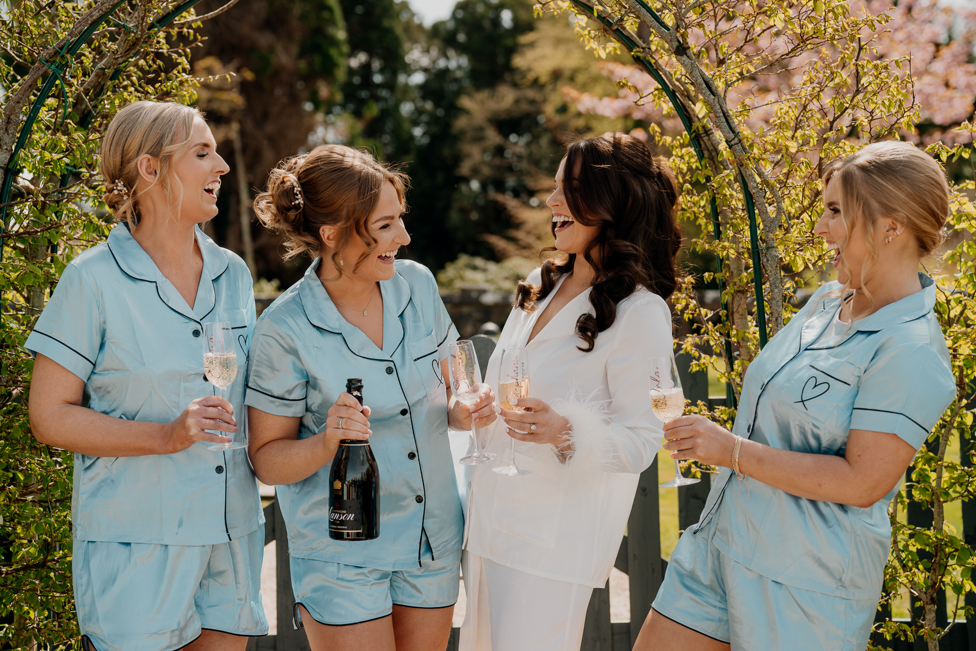 A group of women holding wine glasses