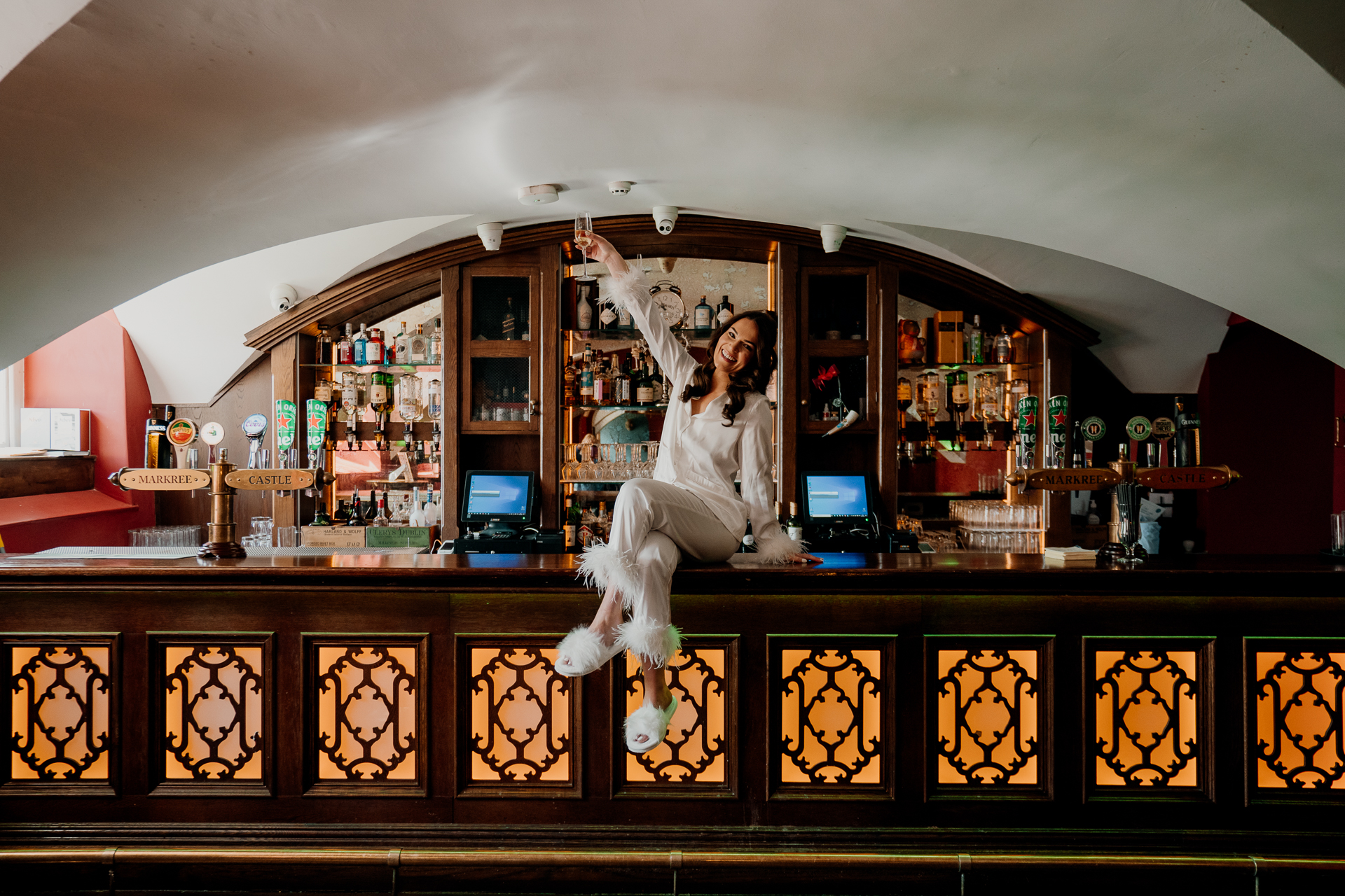 A person sitting on a bar