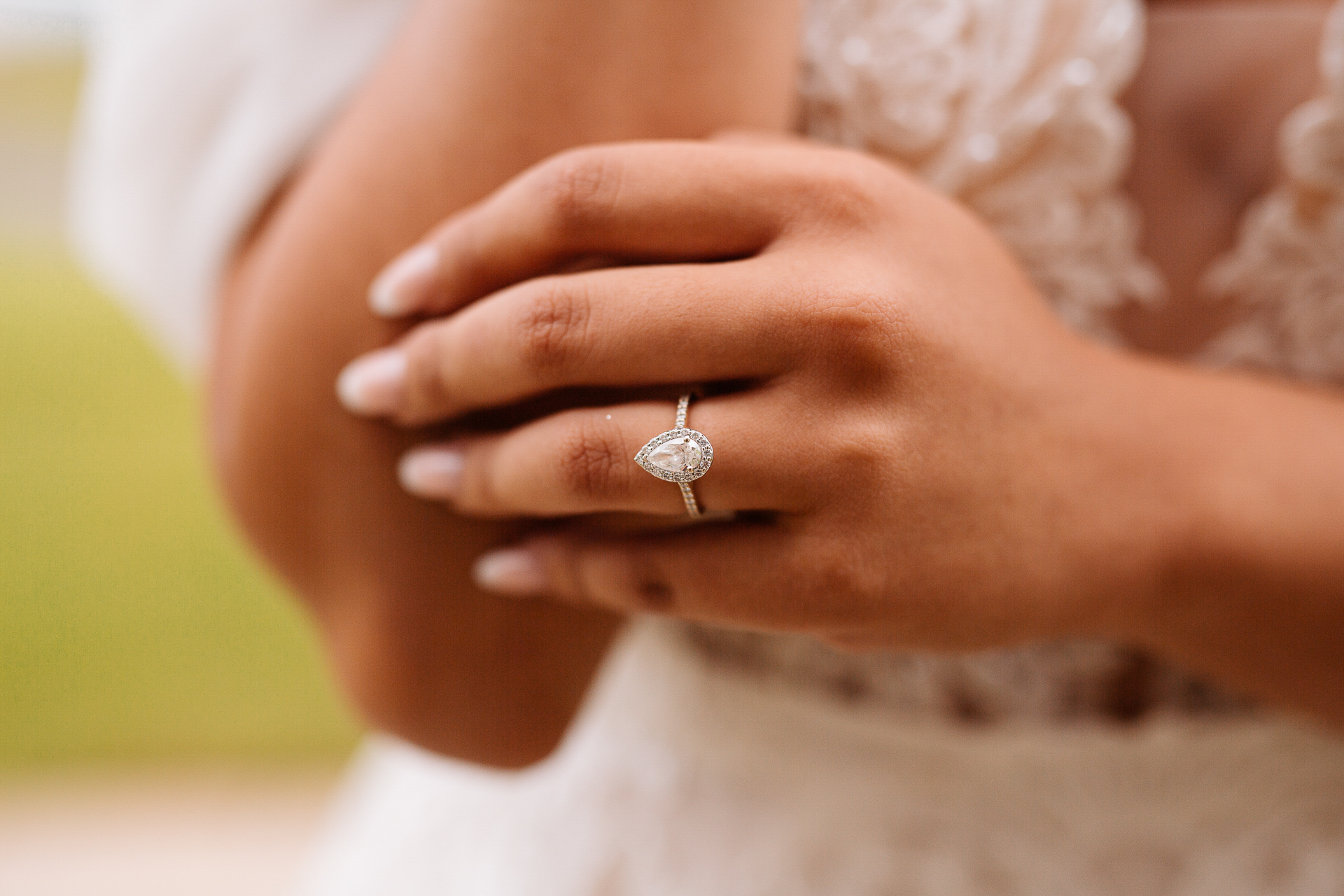 A person holding a wedding ring