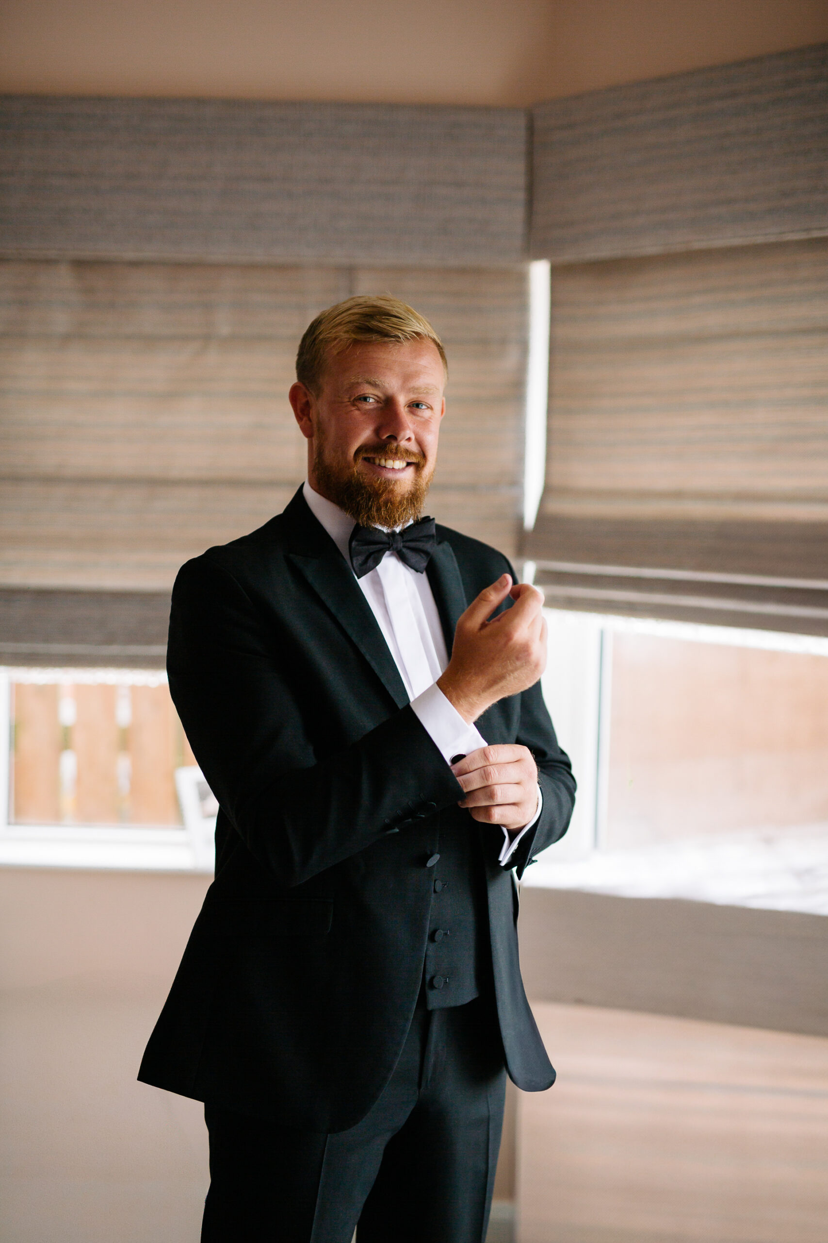 A man in a suit and bow tie