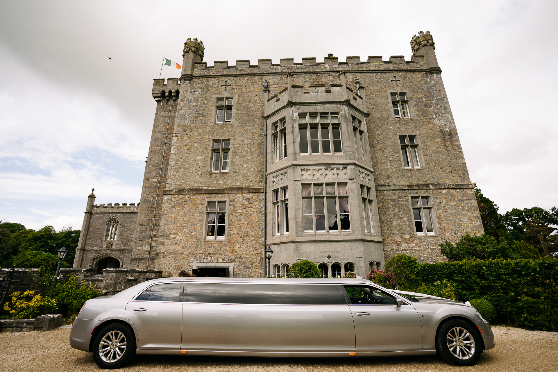 A car parked in front of a large building