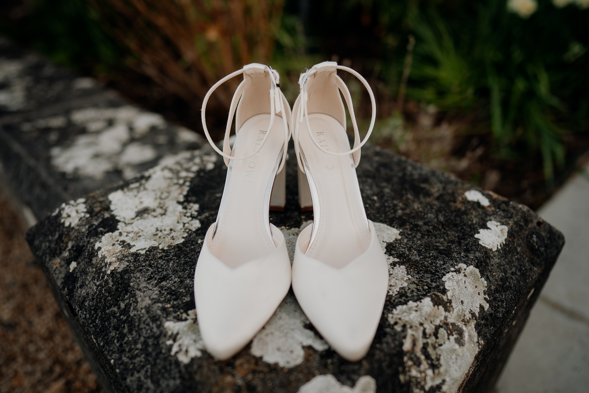 A pair of white shoes on a rock