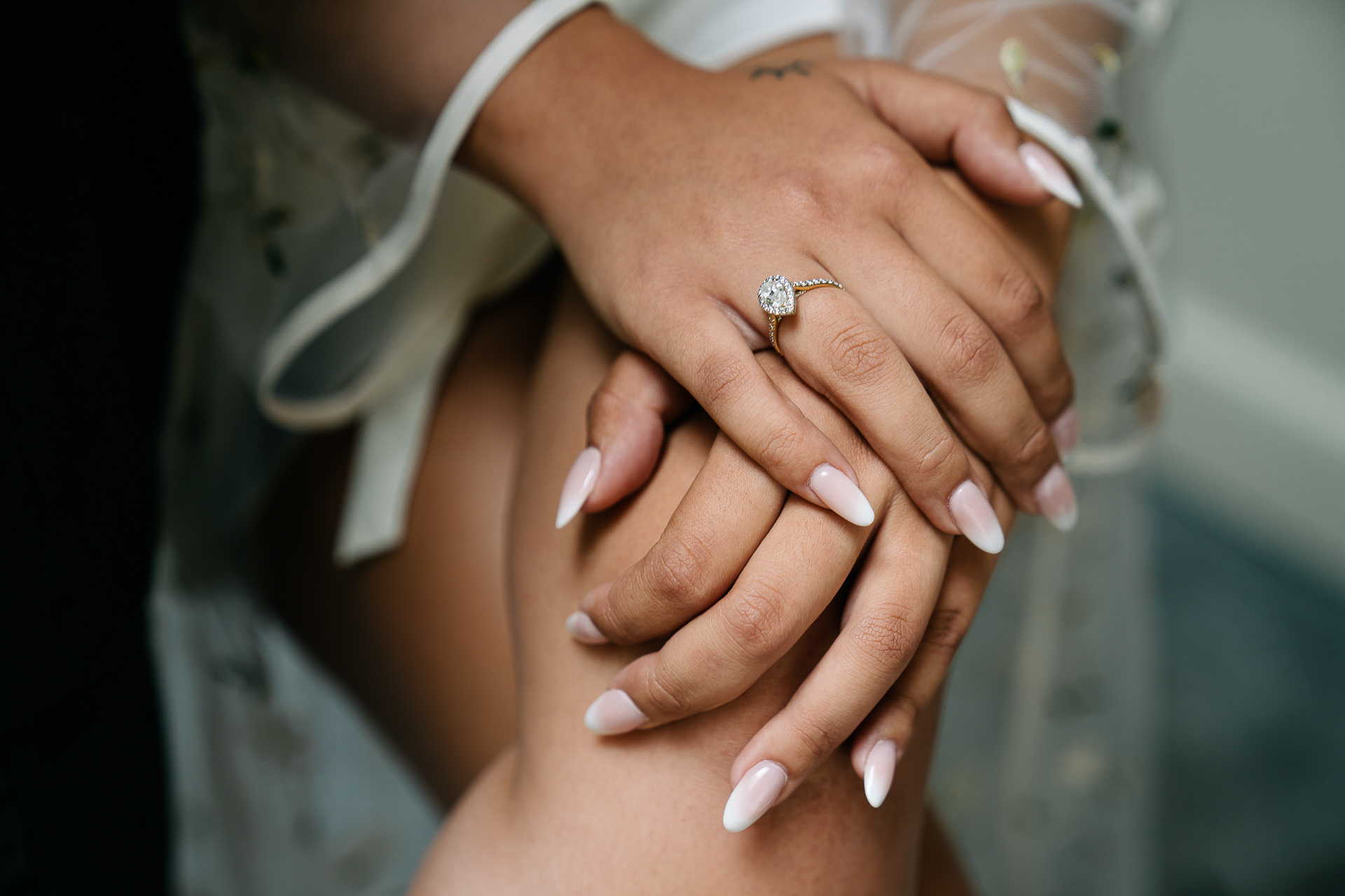 A close-up of hands holding each other