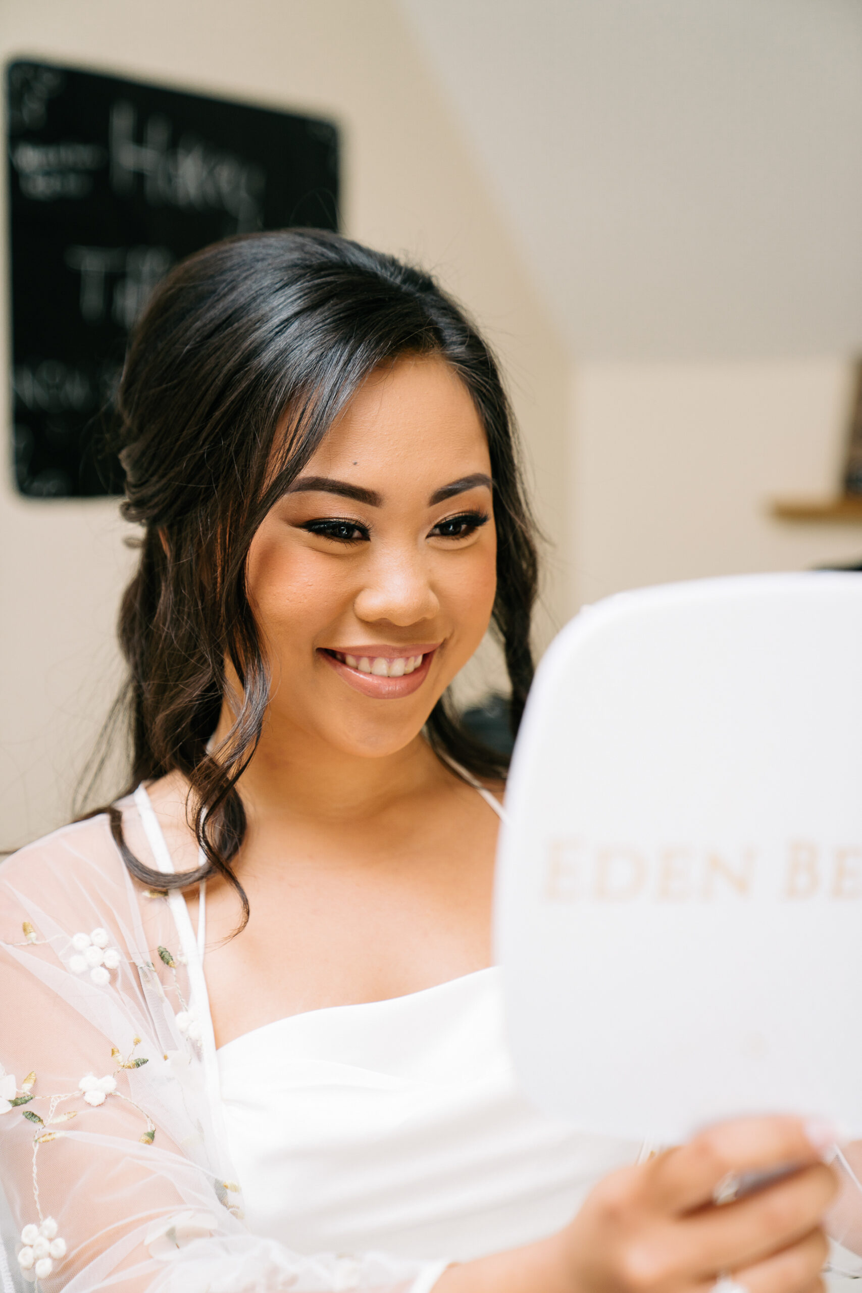 A woman holding a piece of paper