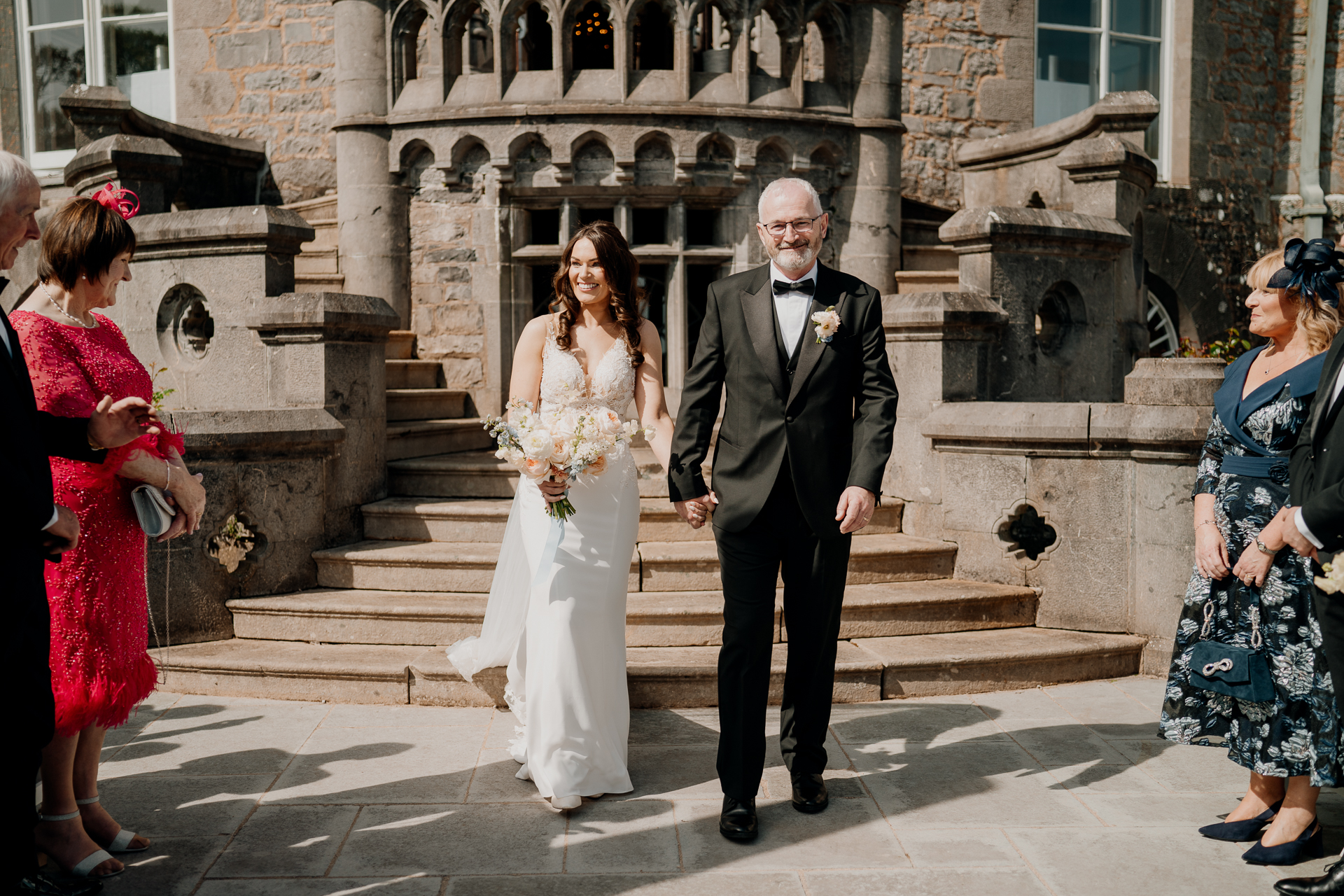 A man and woman walking down a sidewalk