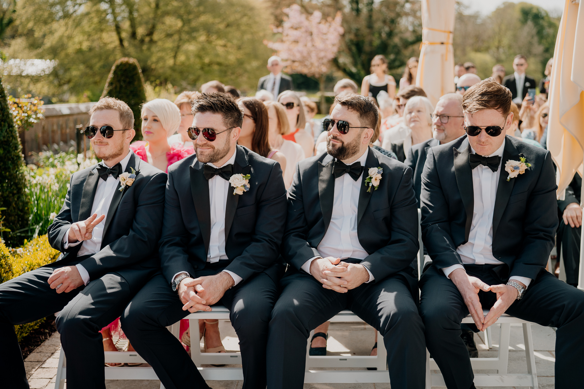 A group of men sitting on a bench