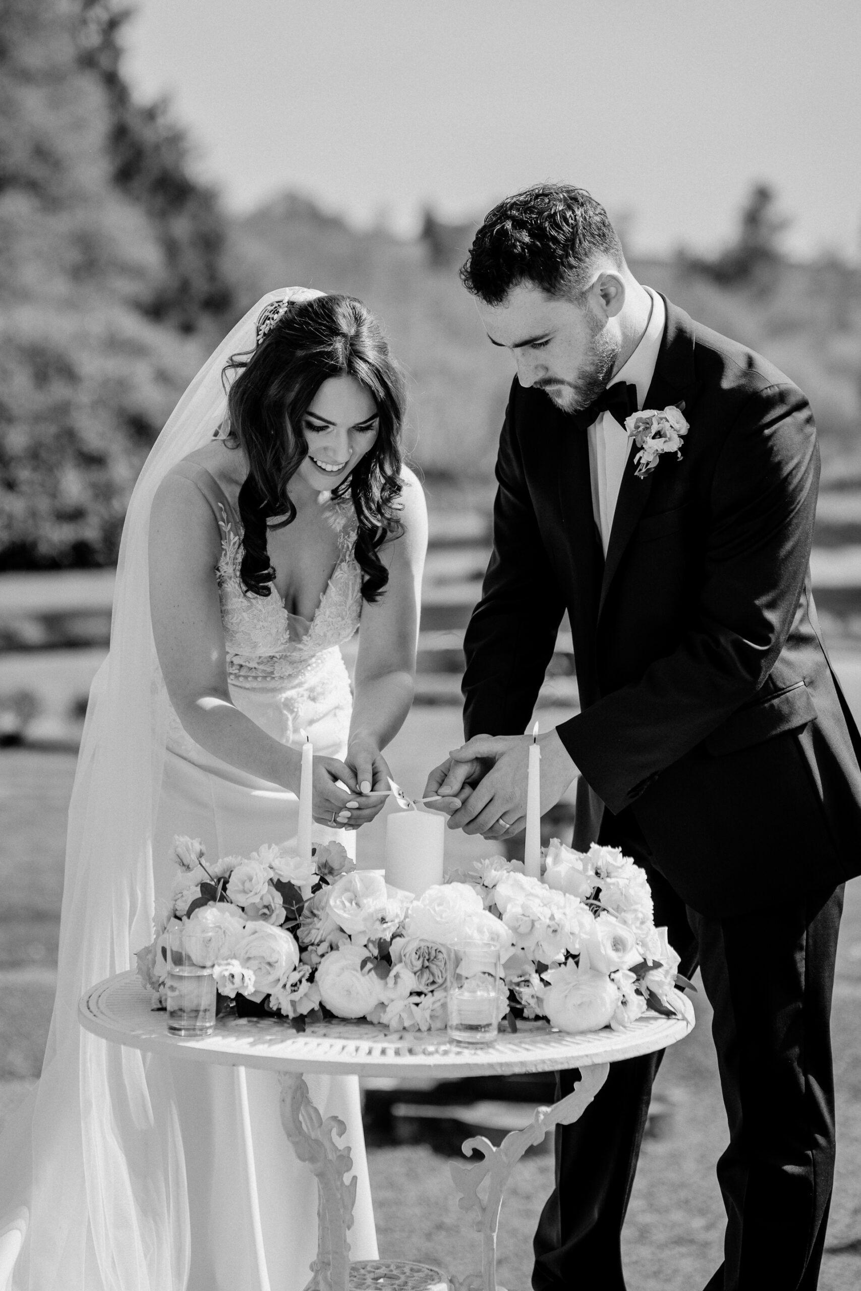 A bride and groom cutting a cake