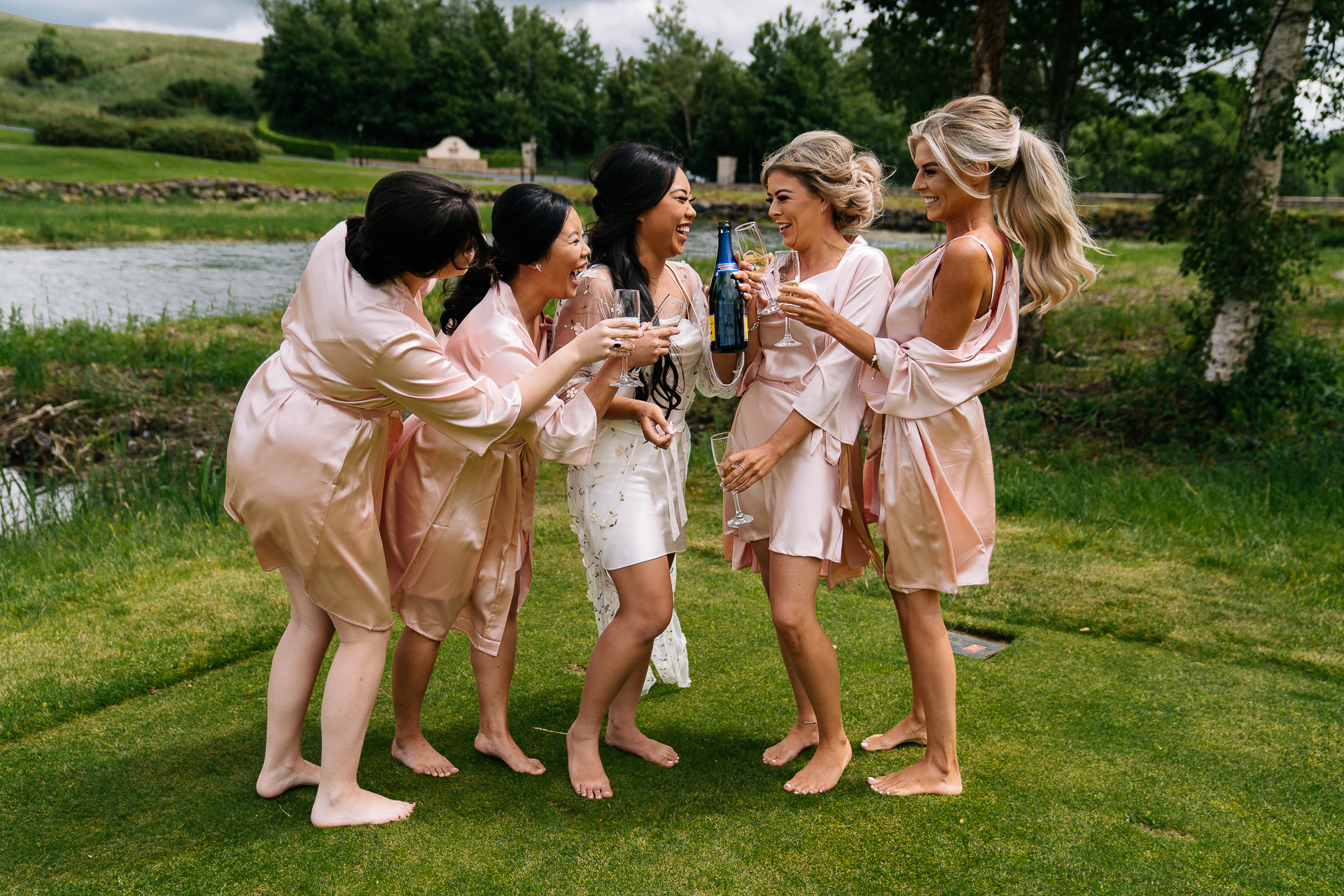 A group of women standing on grass