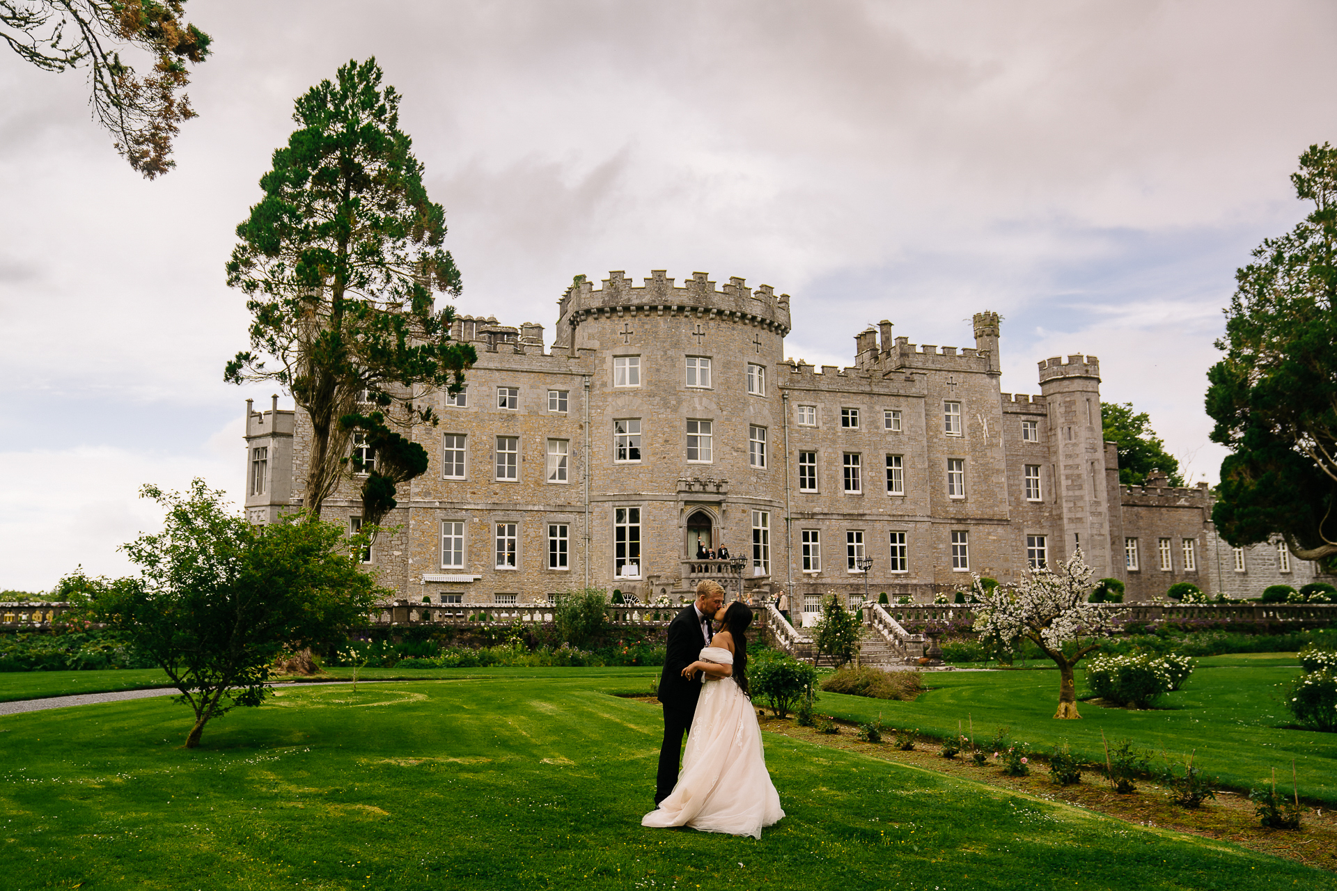 A man and woman in front of a large building