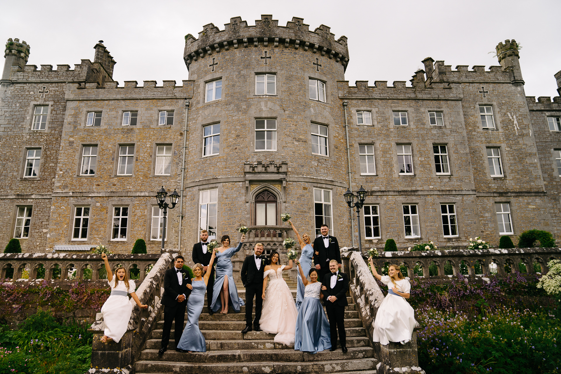 A group of people in front of a large building