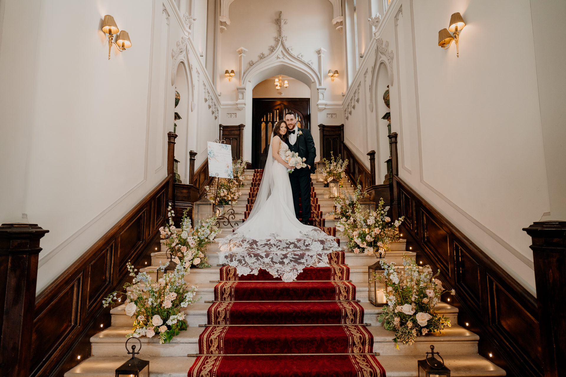 A bride and groom on the stairs