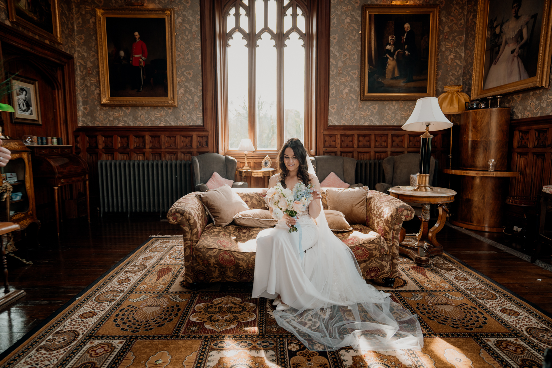 A person in a wedding dress sitting on a couch