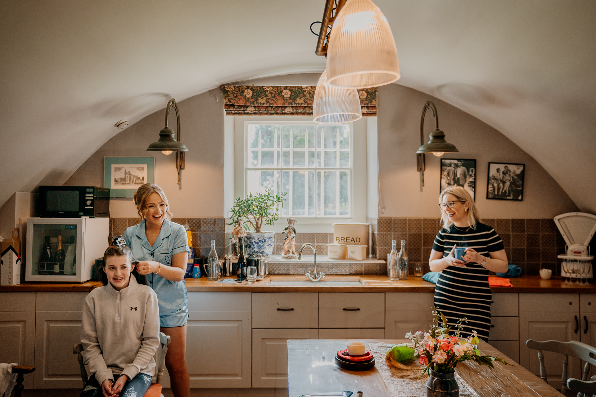 A couple of women in a kitchen