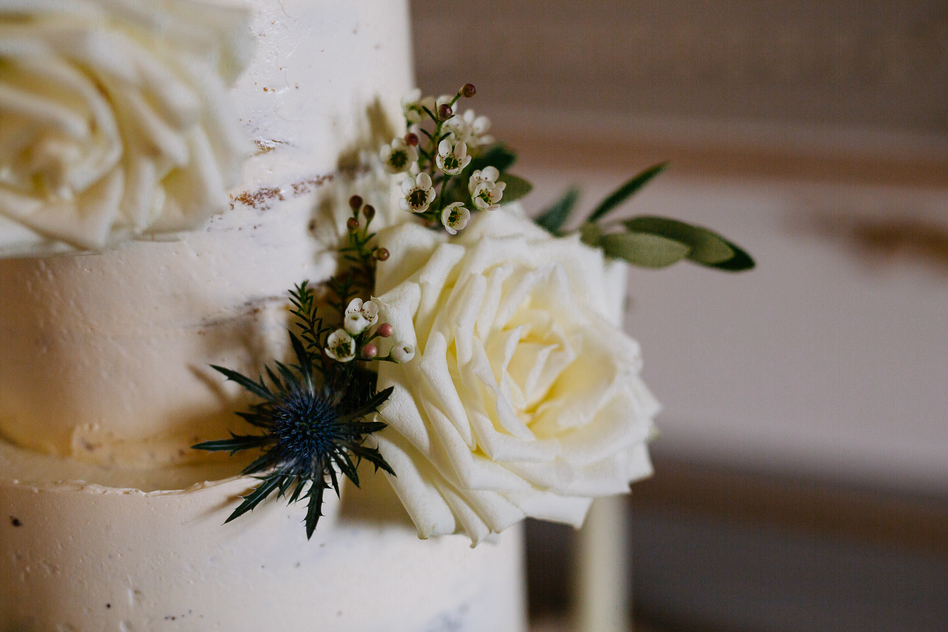 A white vase with flowers