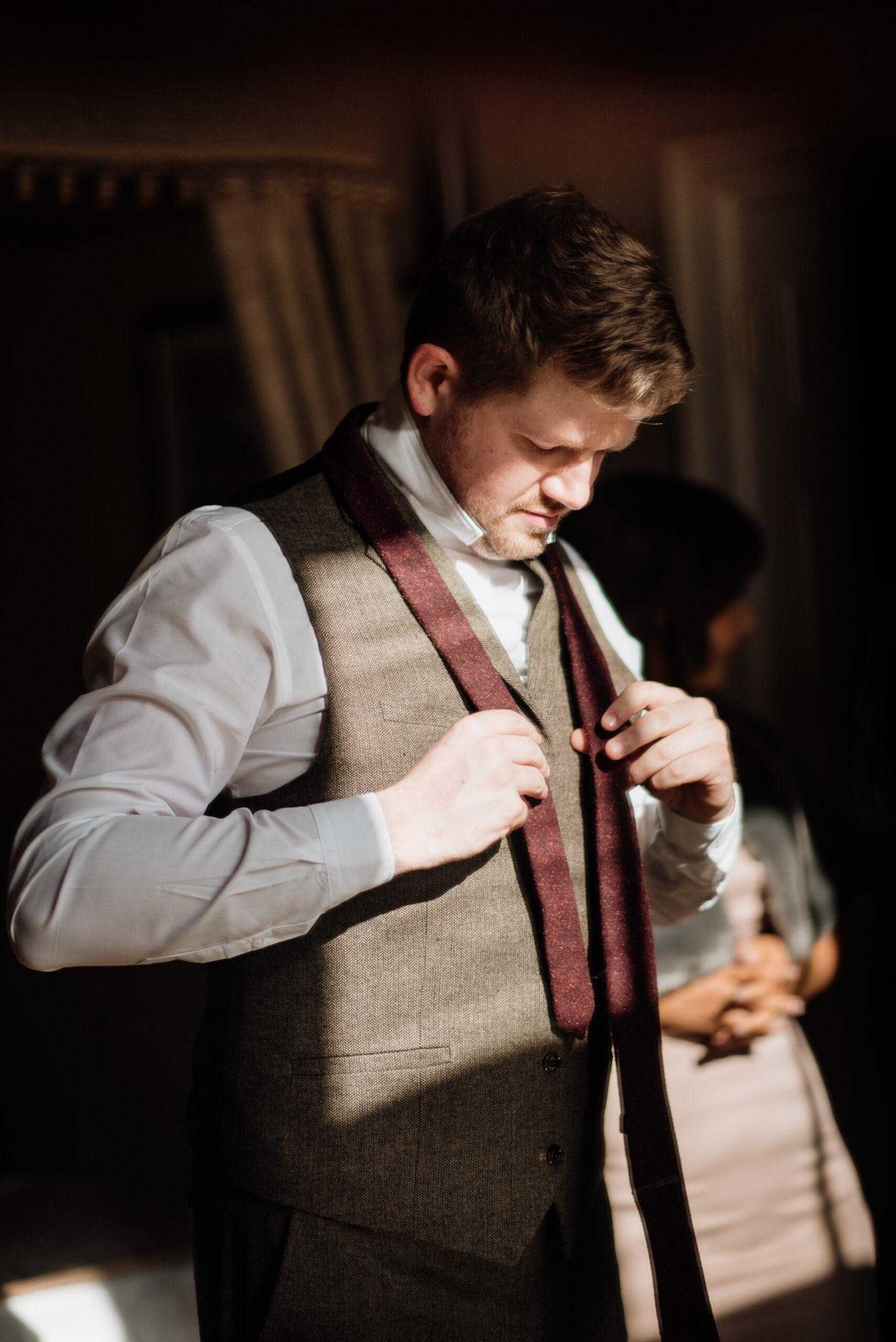 A man adjusting his tie