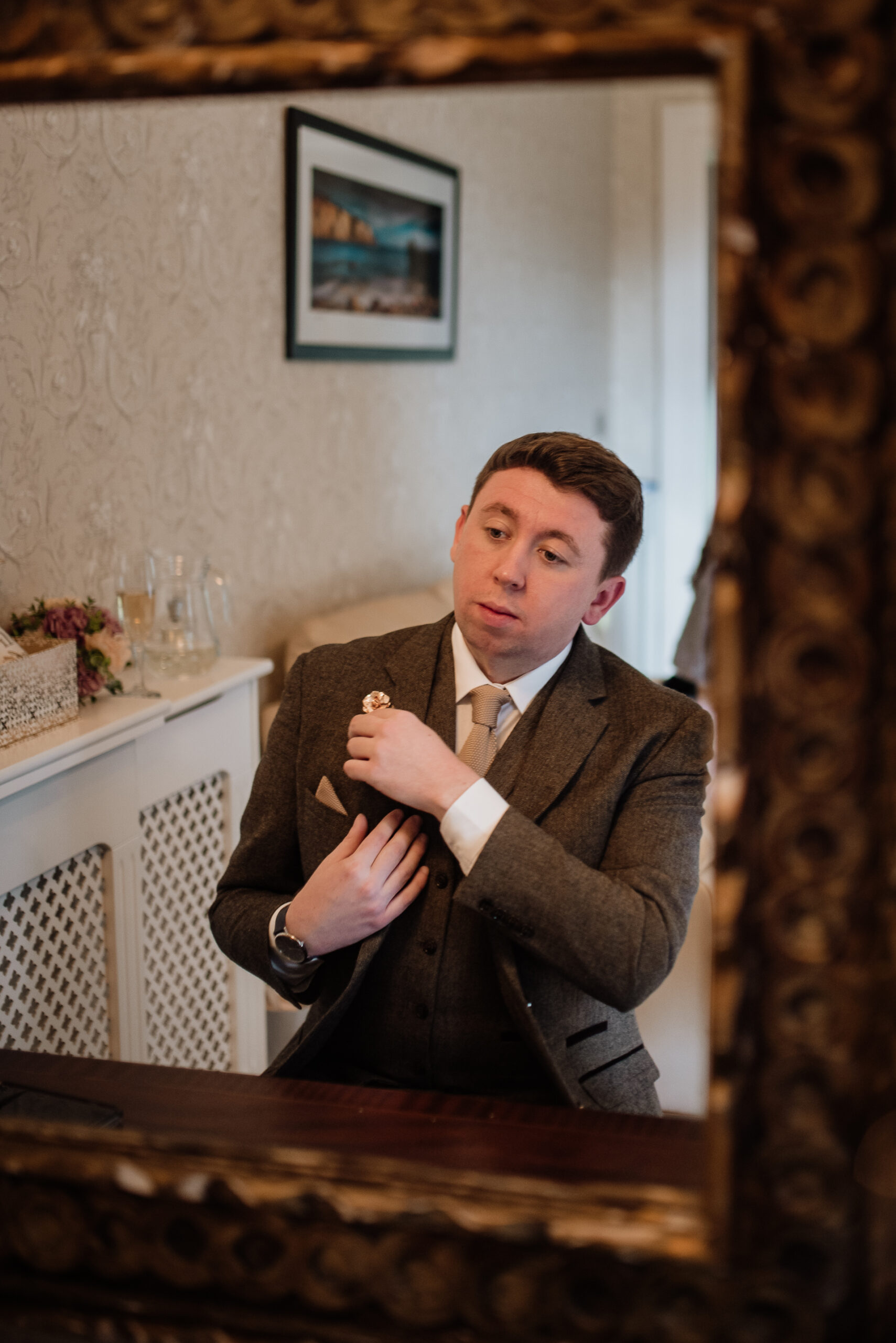 A man in a suit sitting at a table