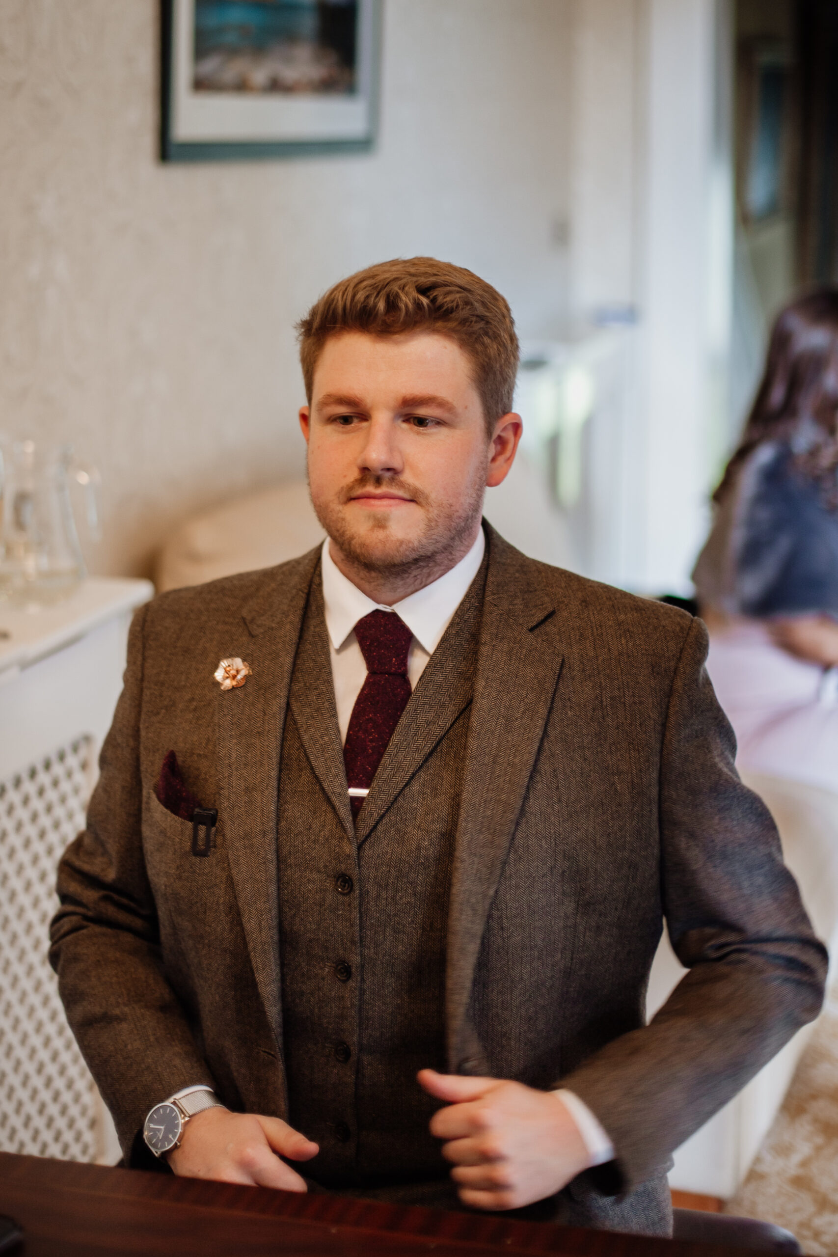 A man in a suit sitting at a table