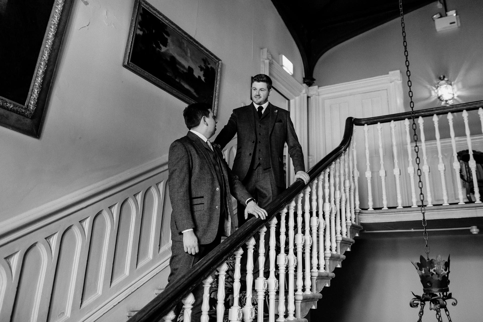 A man and a woman standing on a staircase