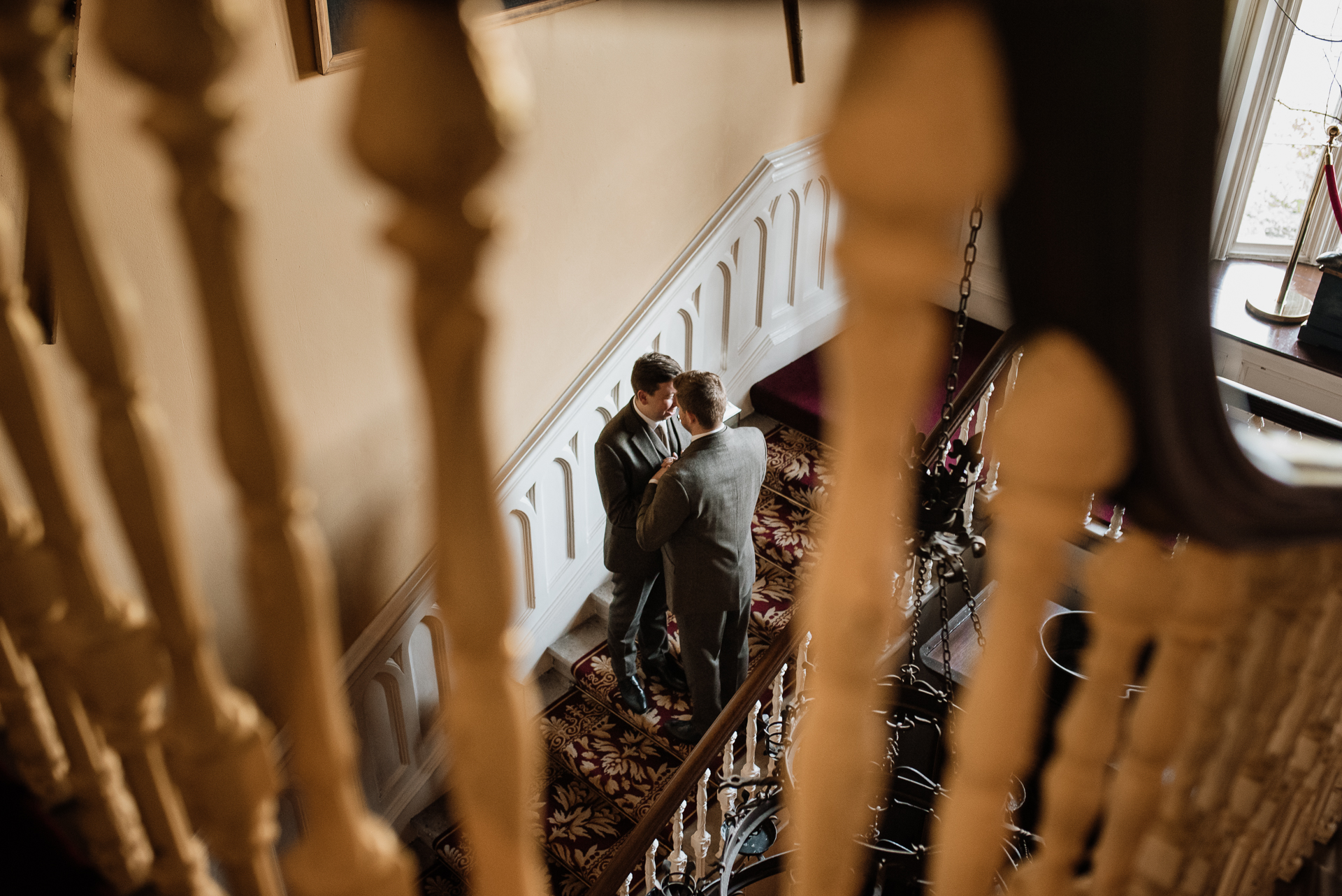 A man and woman walking down a flight of stairs