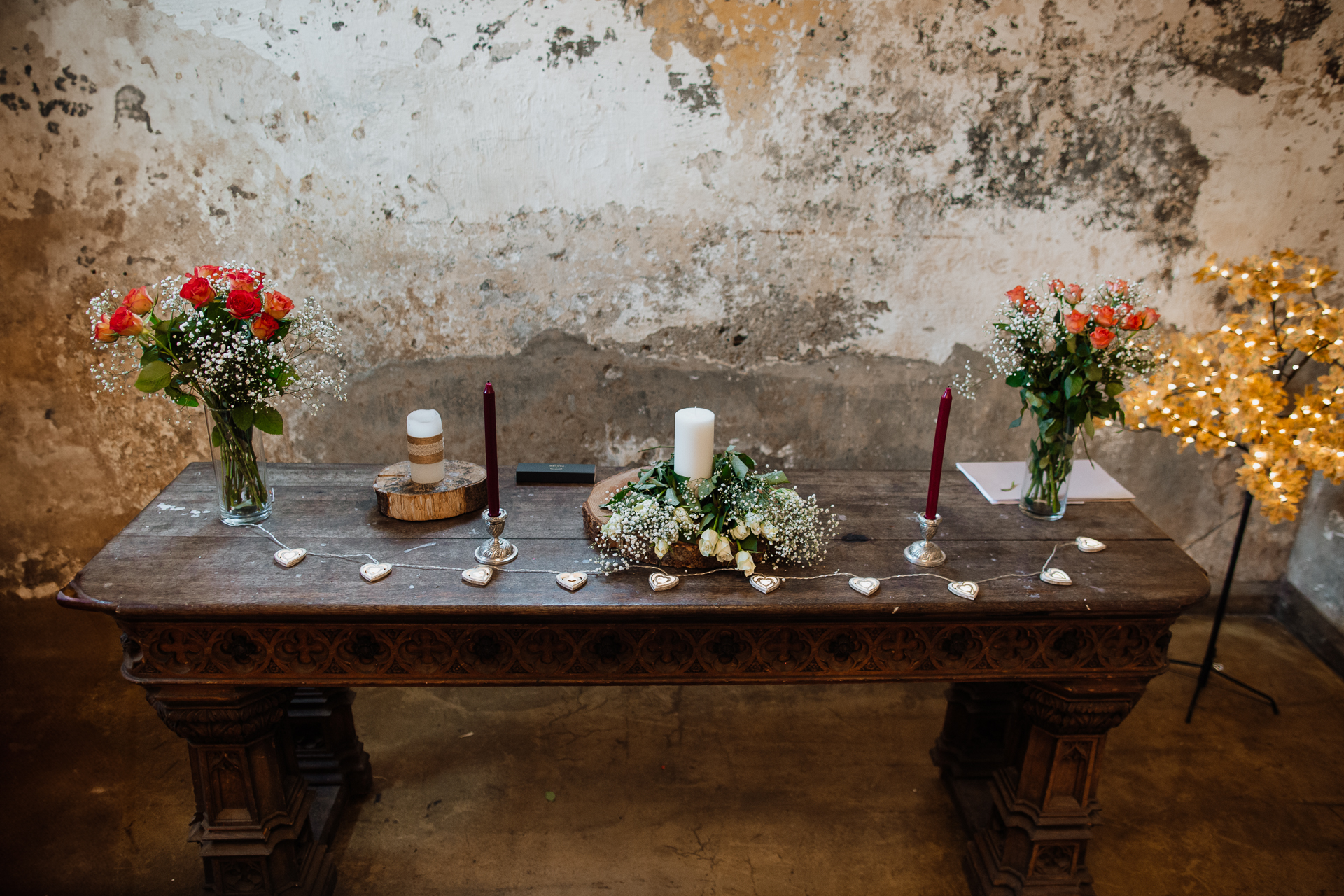 A table with candles and flowers