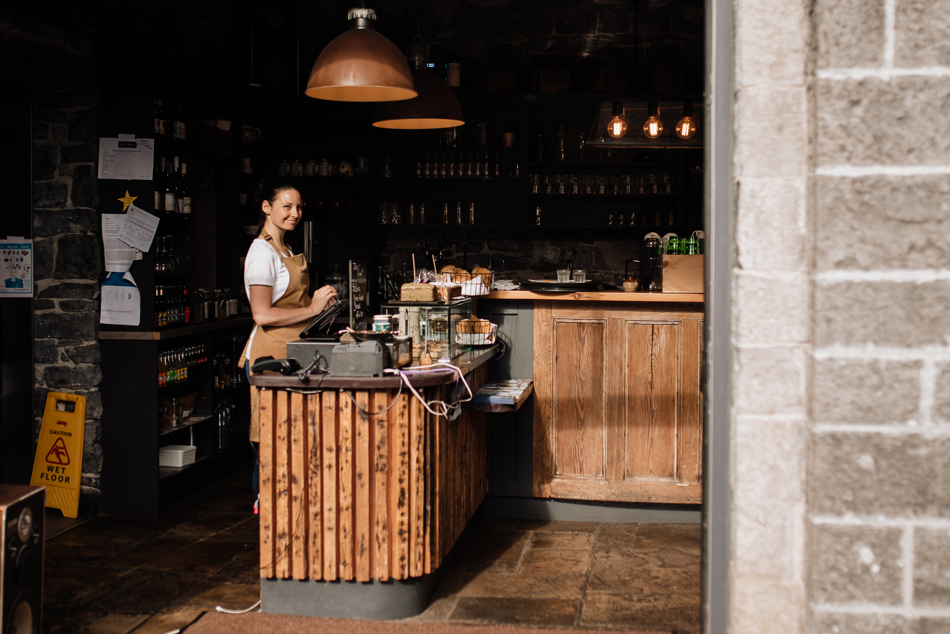 A man standing behind a counter