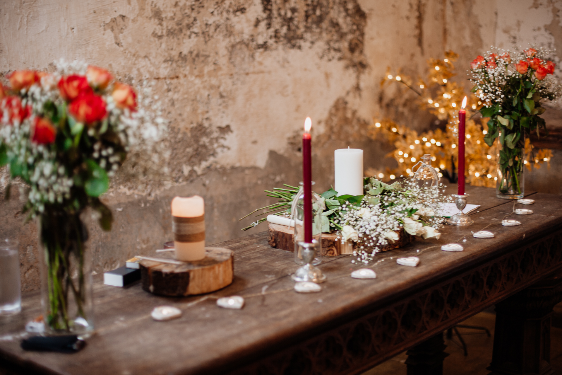 A table with candles and flowers