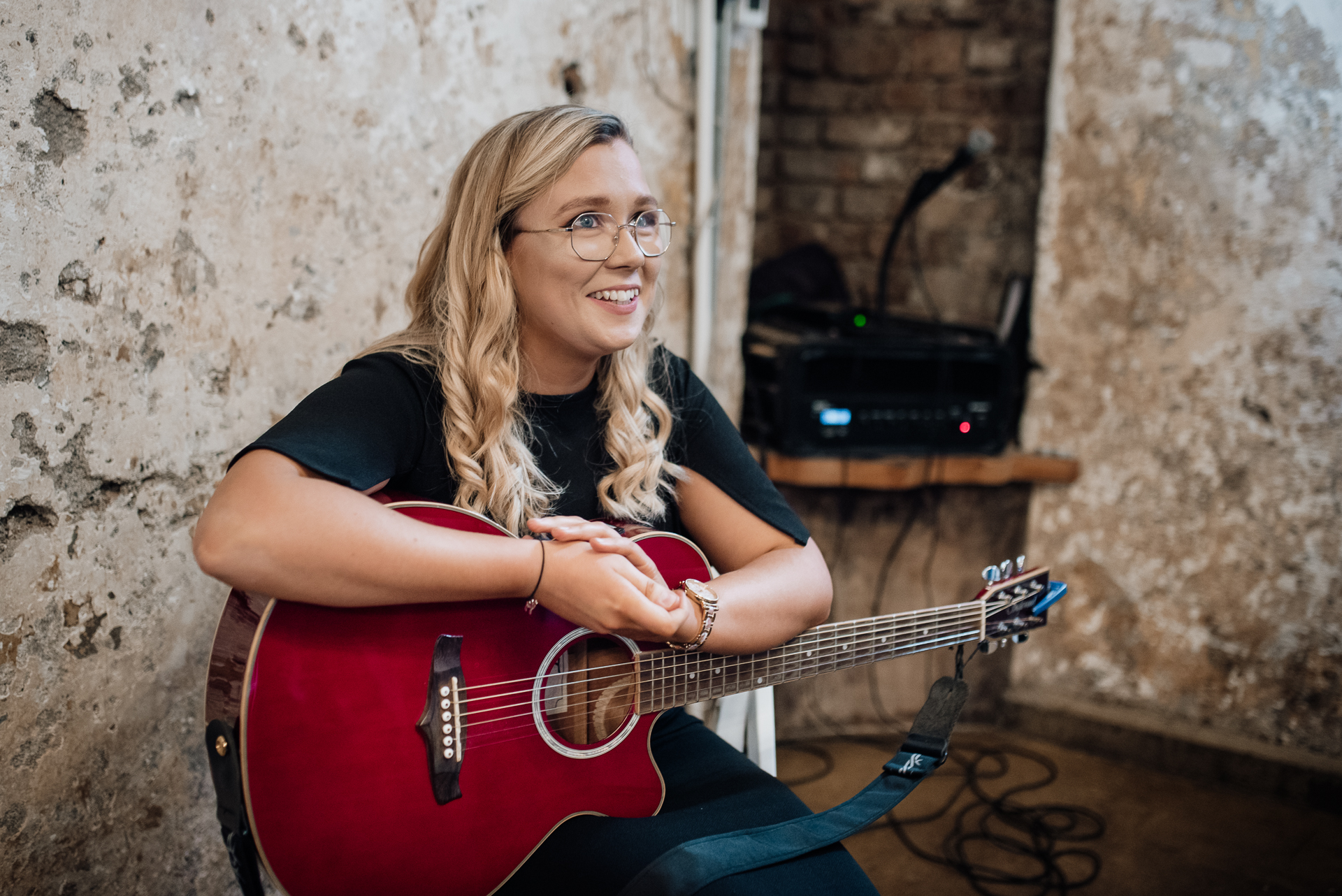 A woman playing a guitar