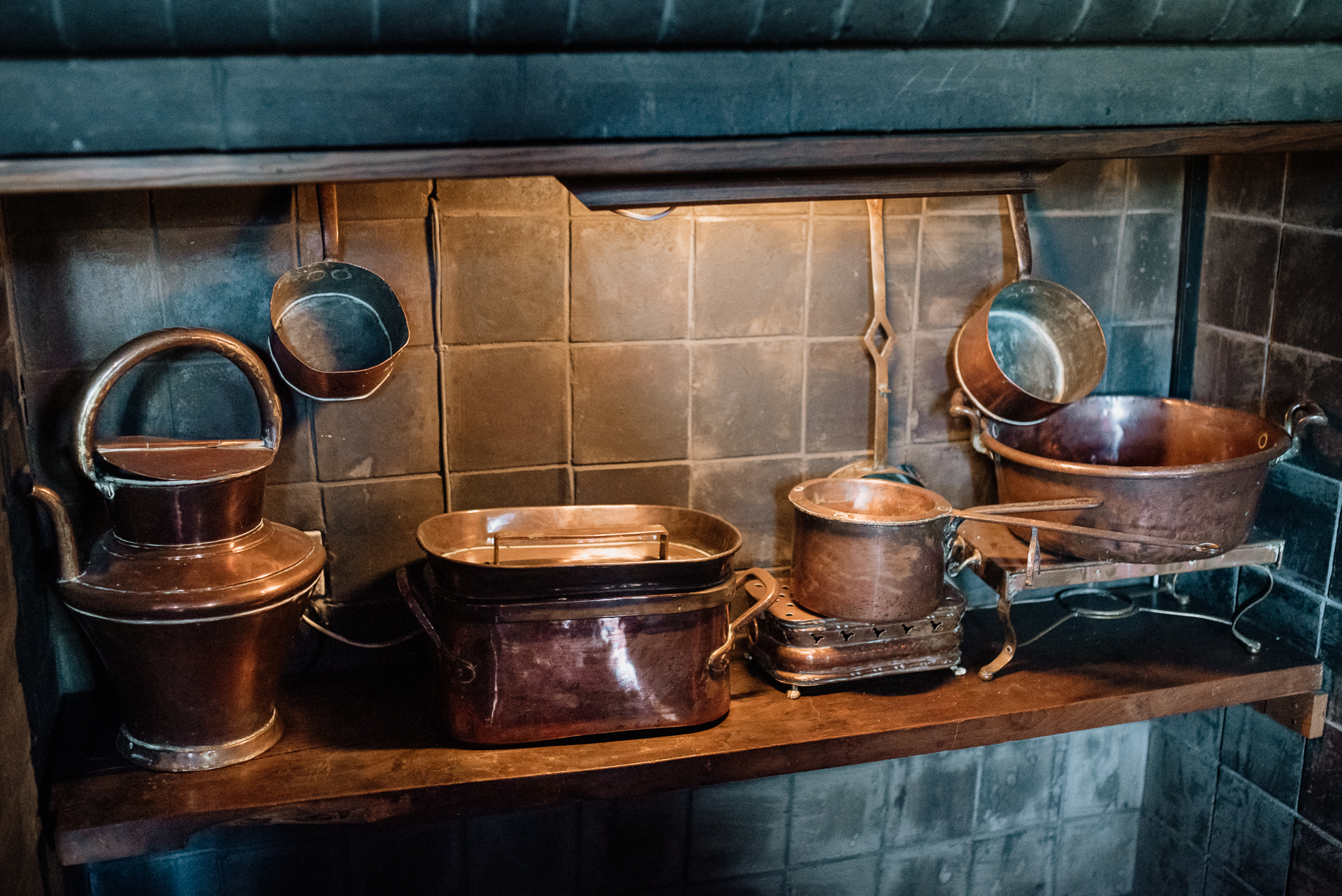 A kitchen counter with pots and pans