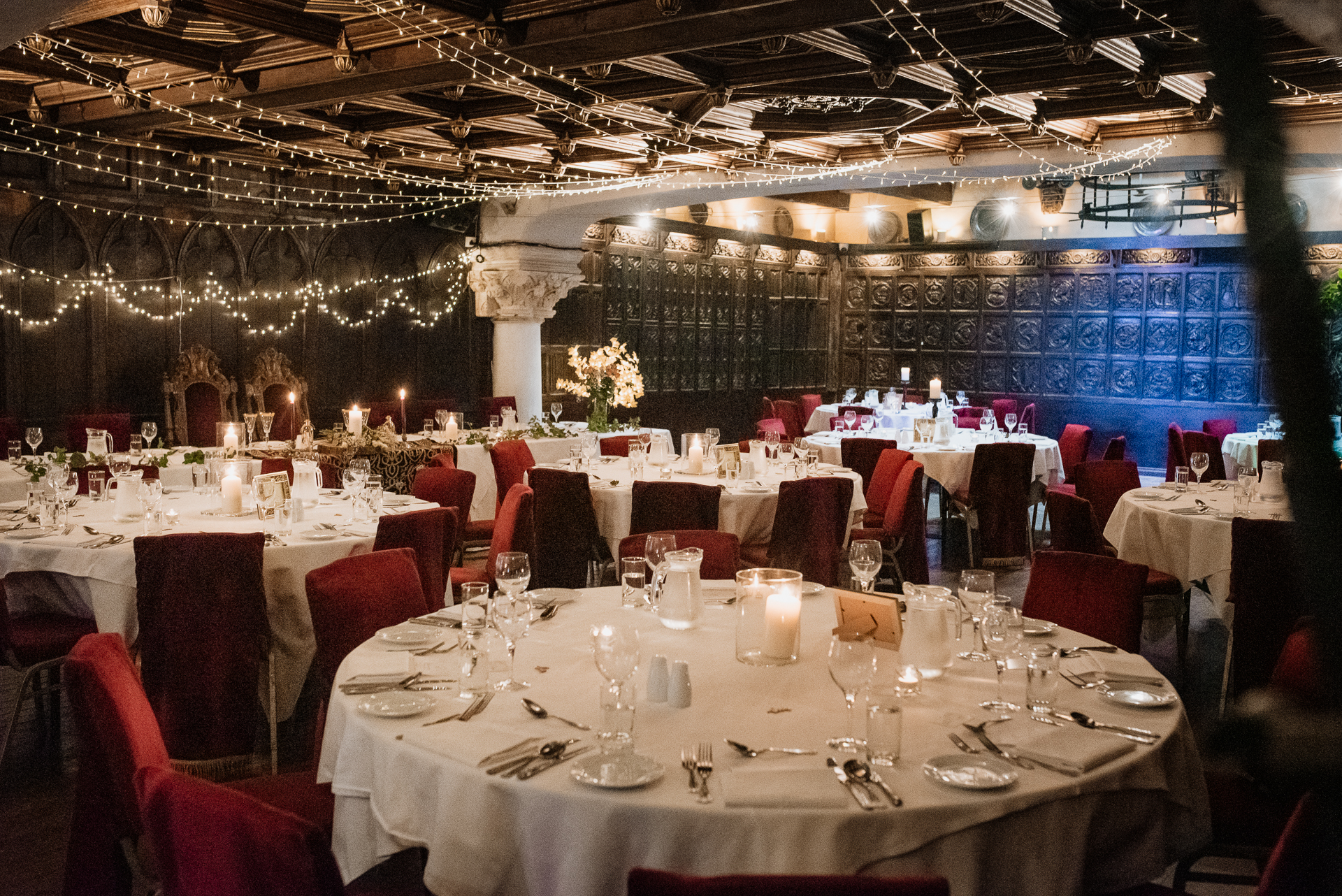 A large room with tables set for a meal