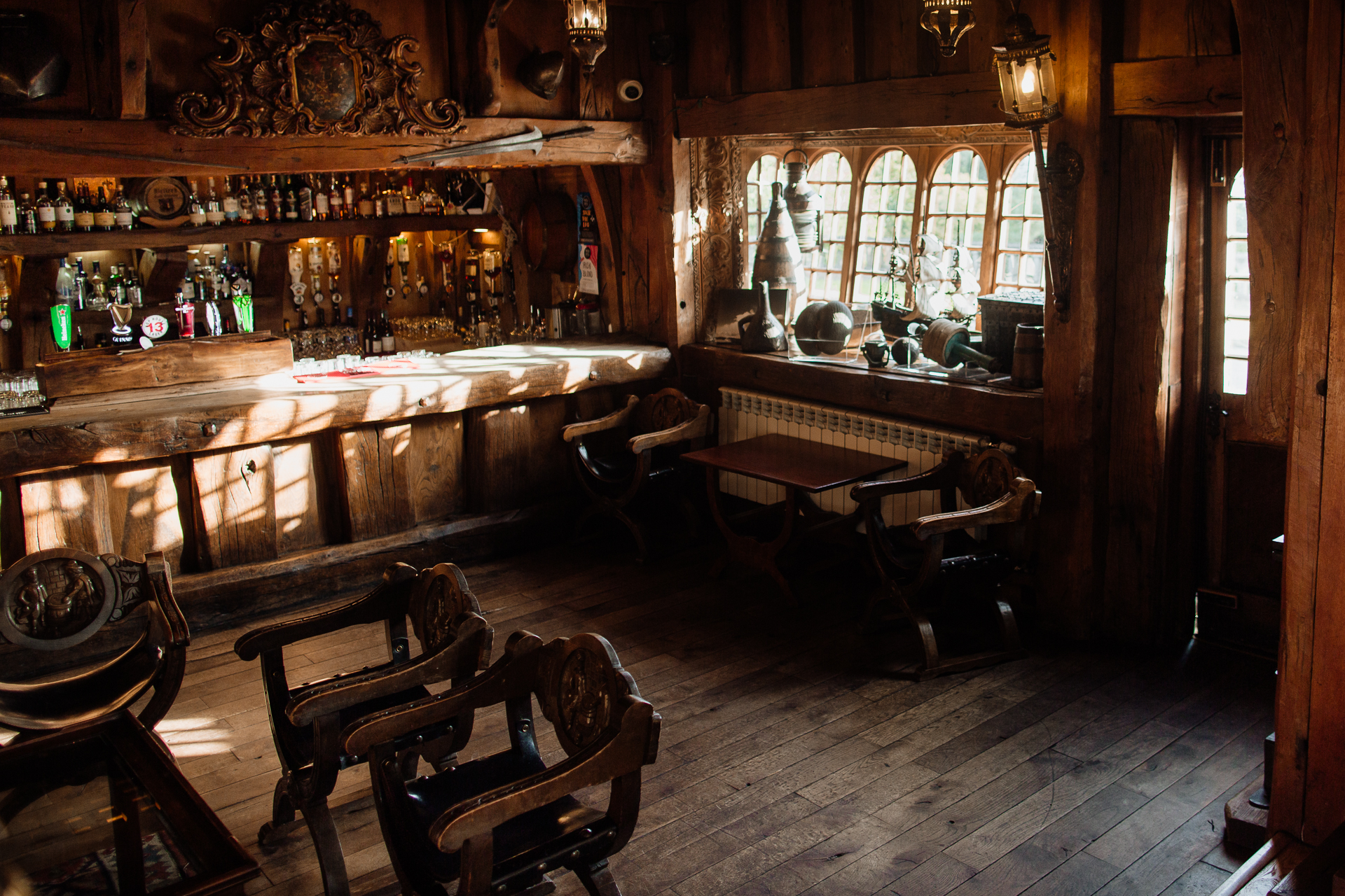 A bar with a bar and chairs