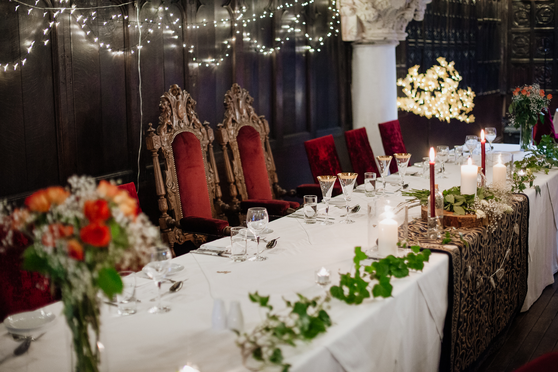 A table with white tables and flowers