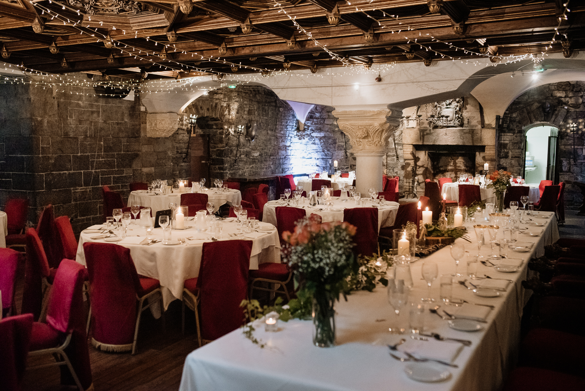 A room with tables set for a meal