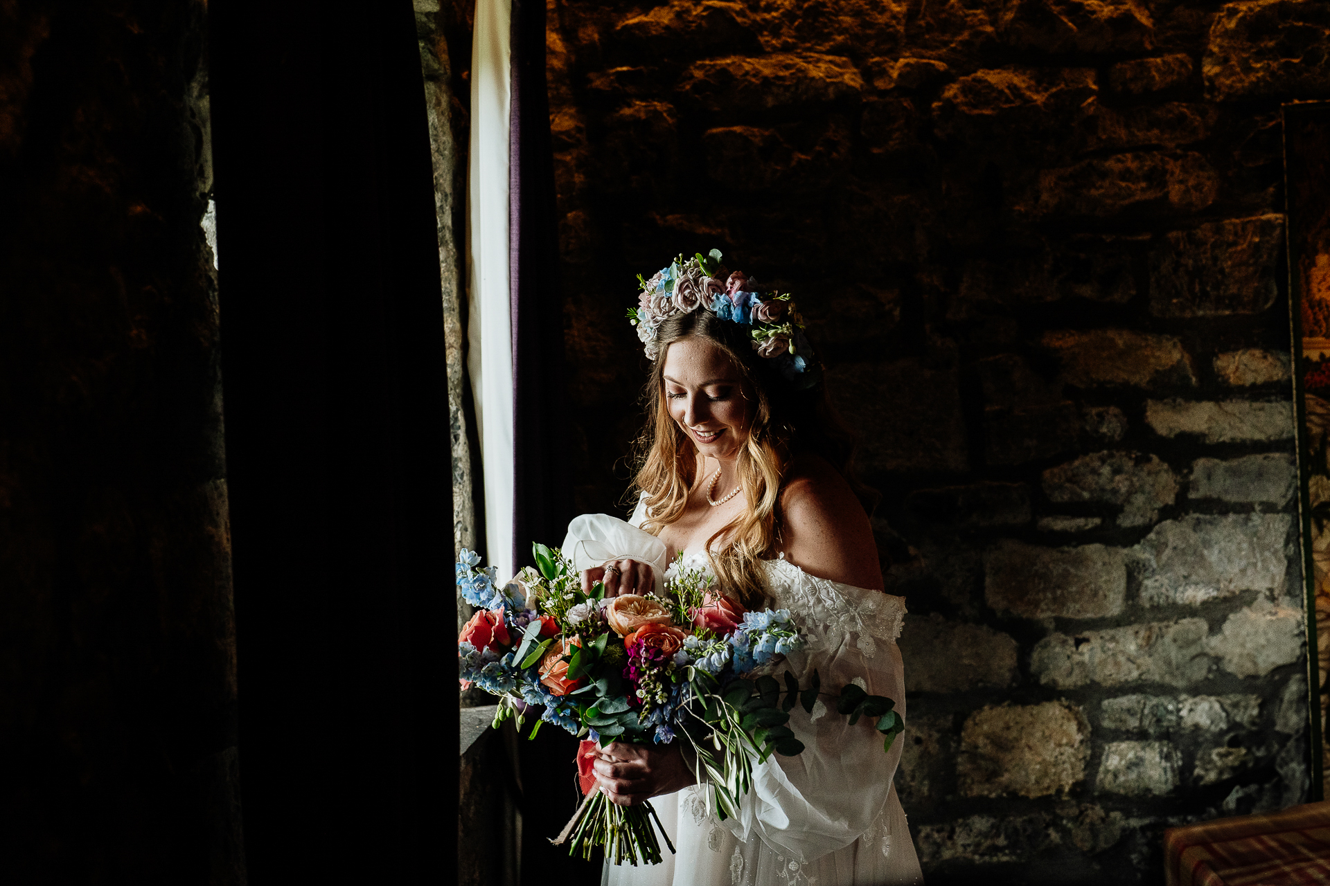 A person in a dress holding flowers