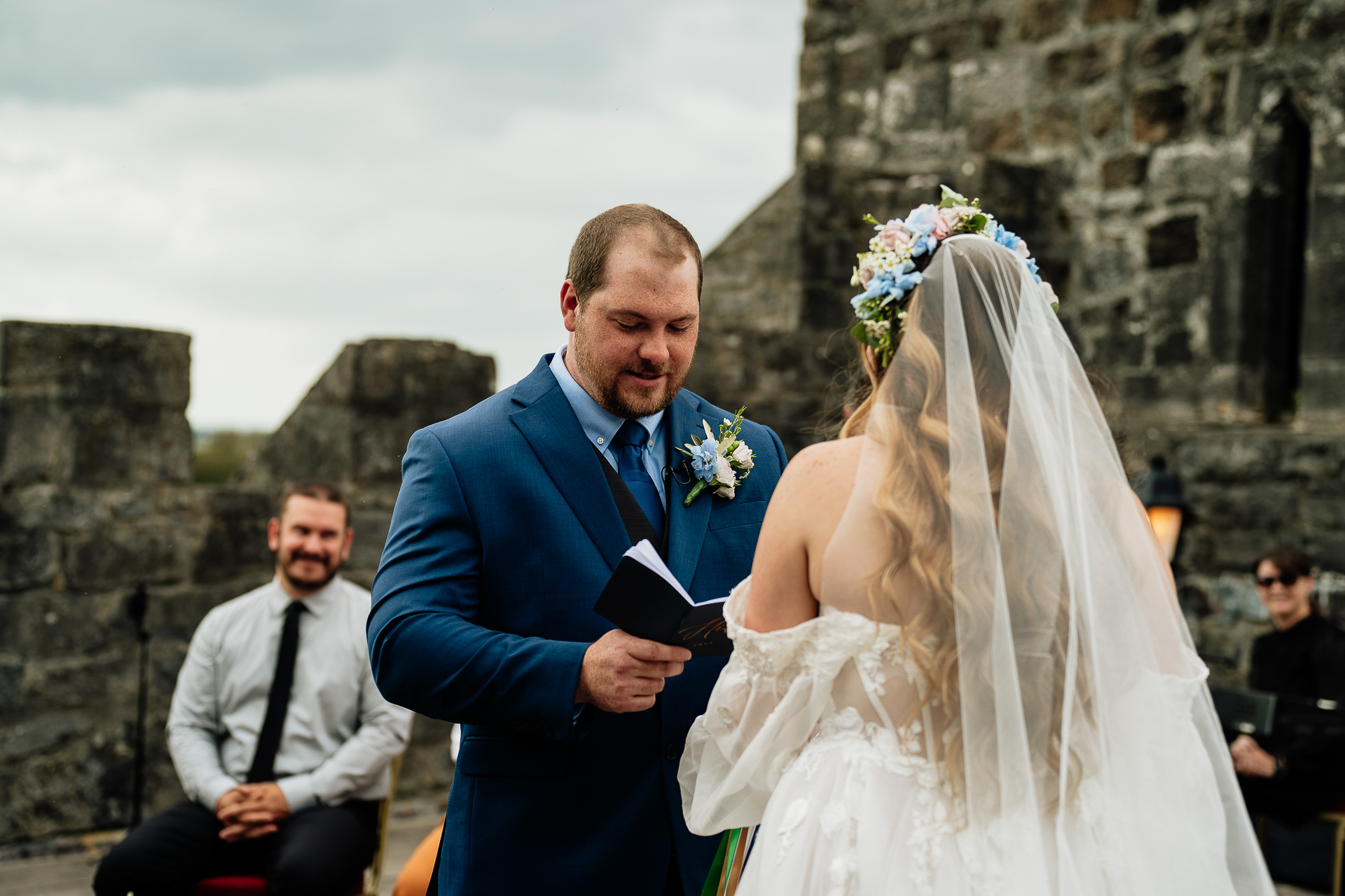 A man in a suit and a woman in a white dress