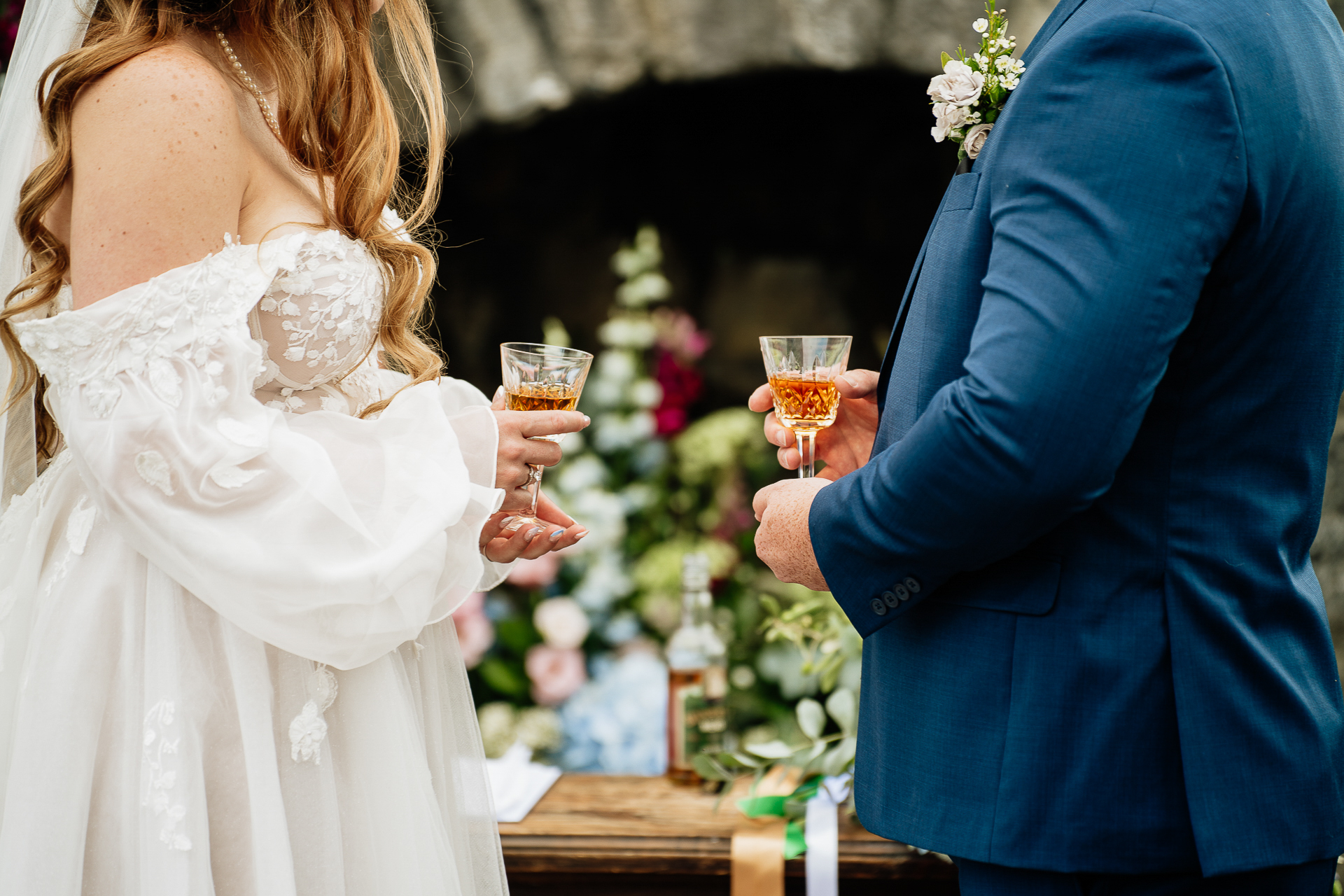 A man and woman holding drinks