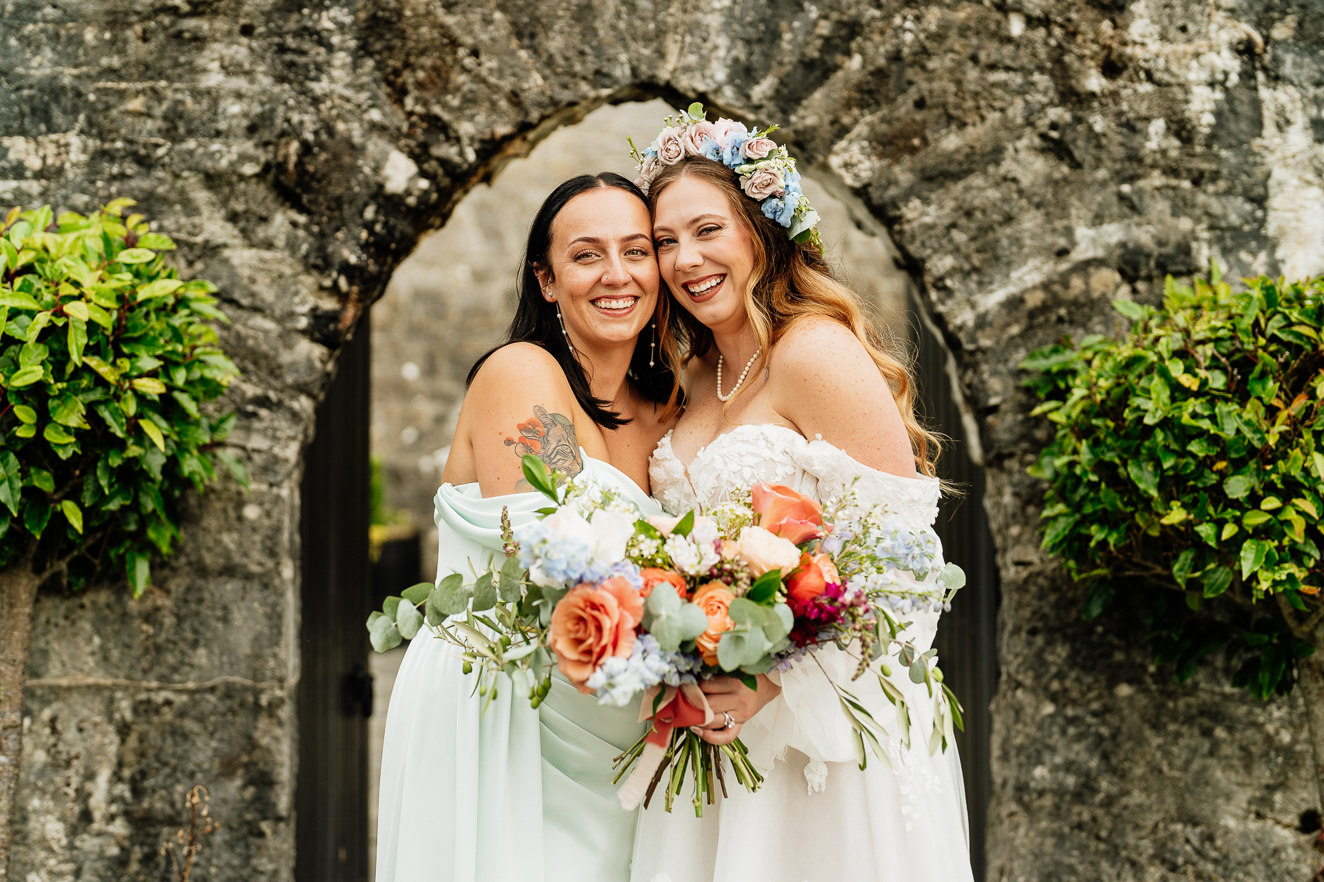 A couple of women in wedding attire