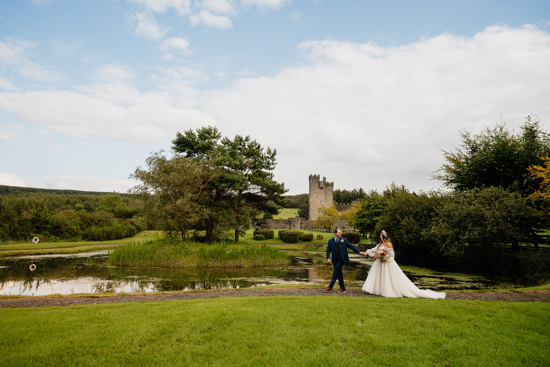 A man and woman walking in a park