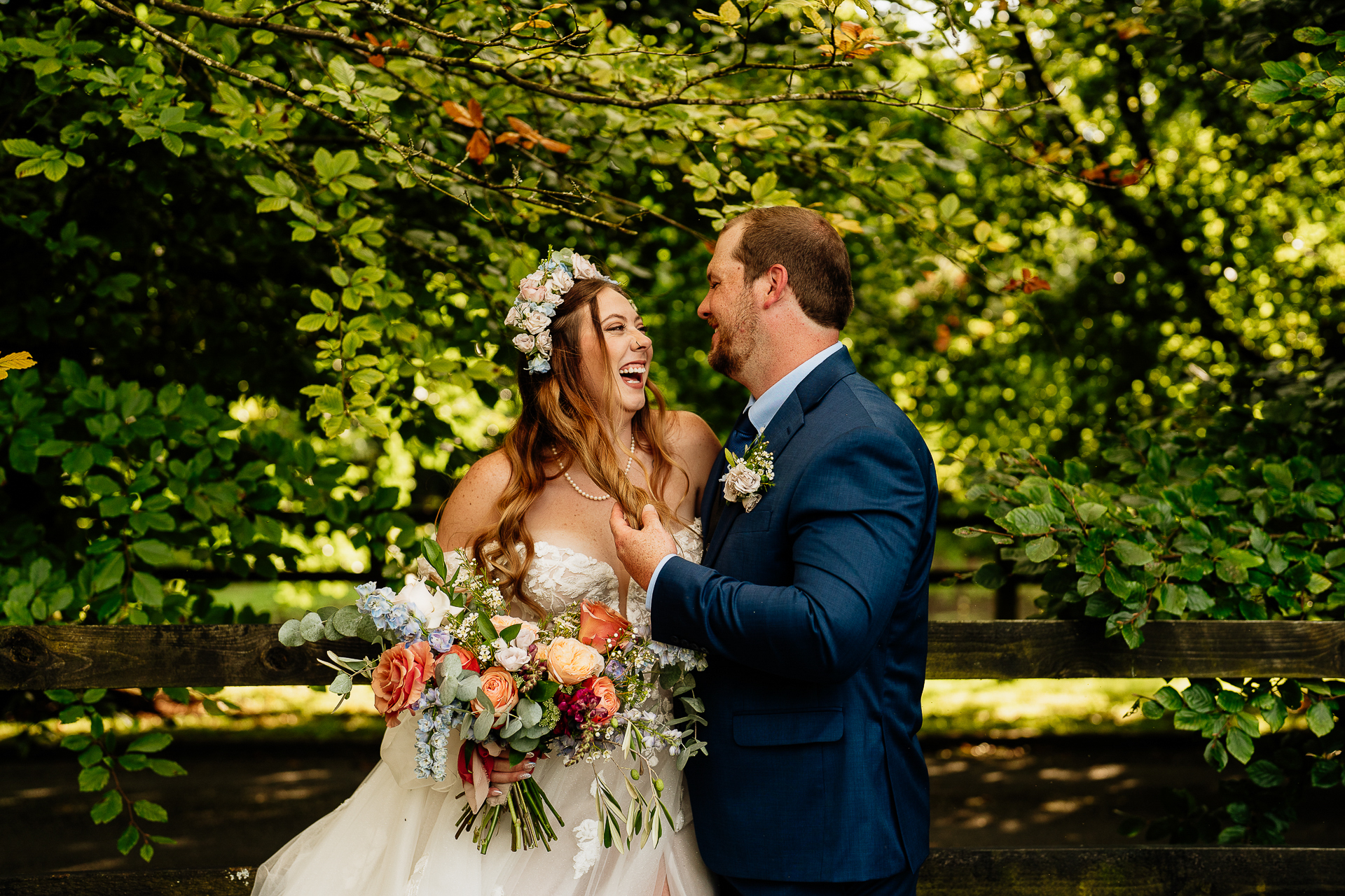 A man and woman holding flowers