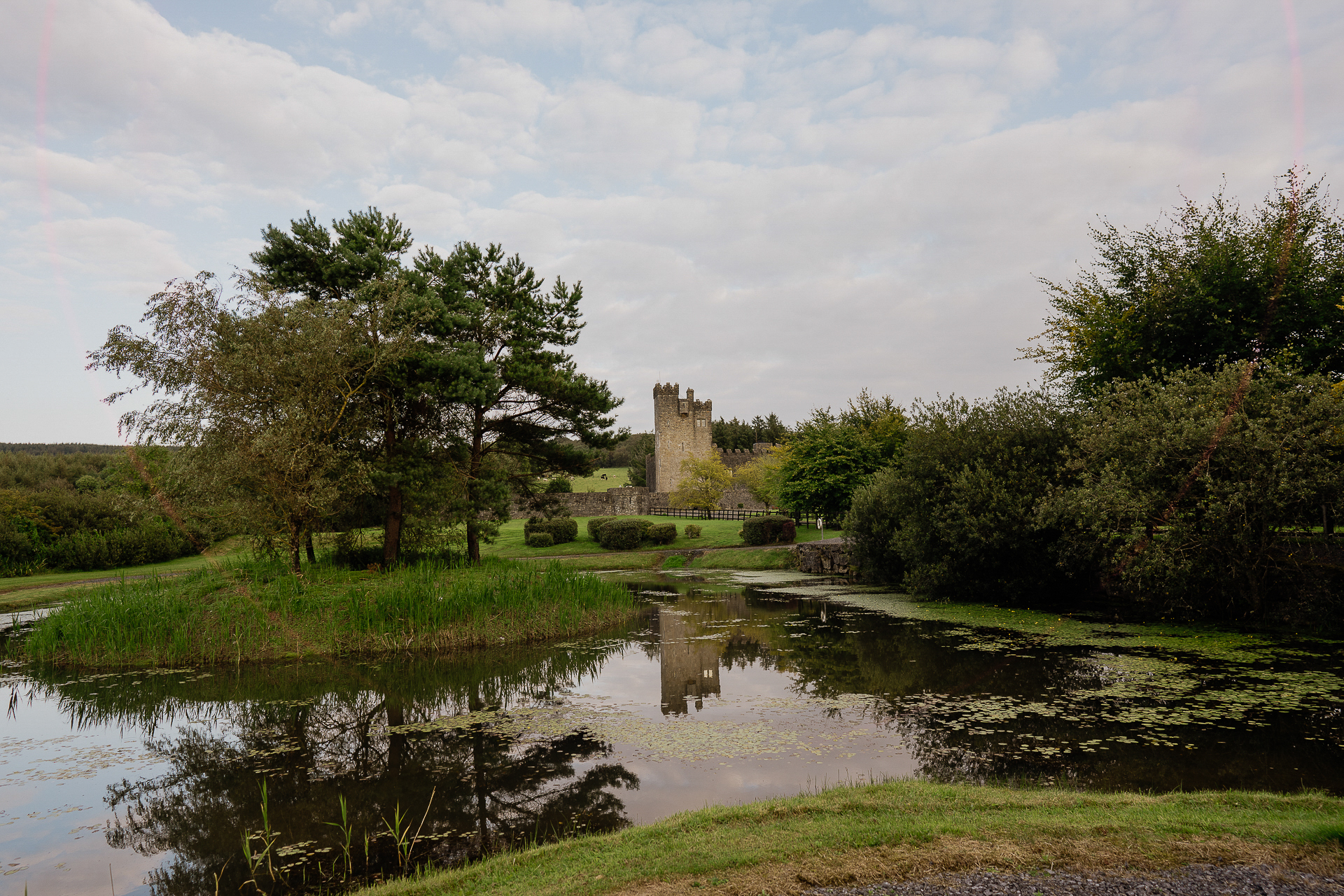 A castle on a hill by a river