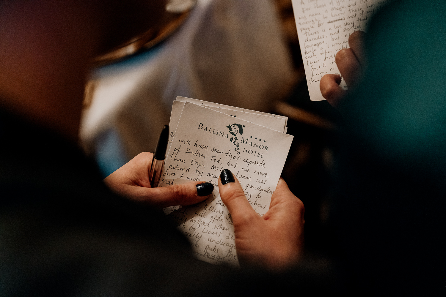 A person writing on a piece of paper