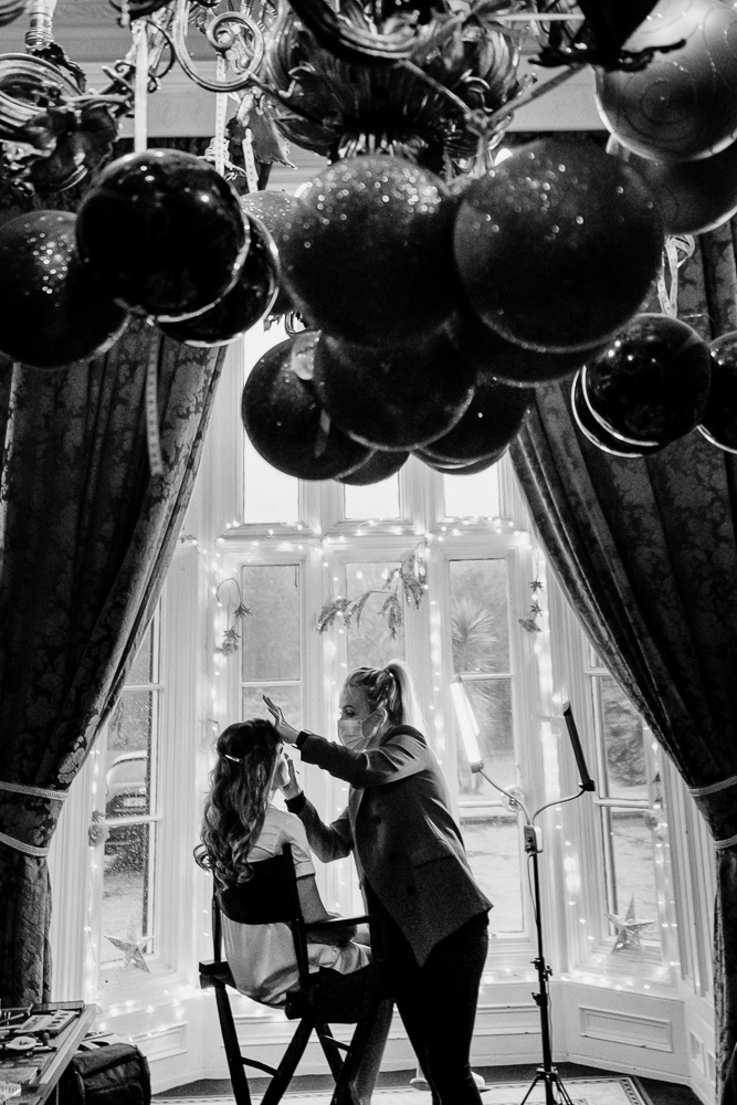 A man and woman looking at a large balloon