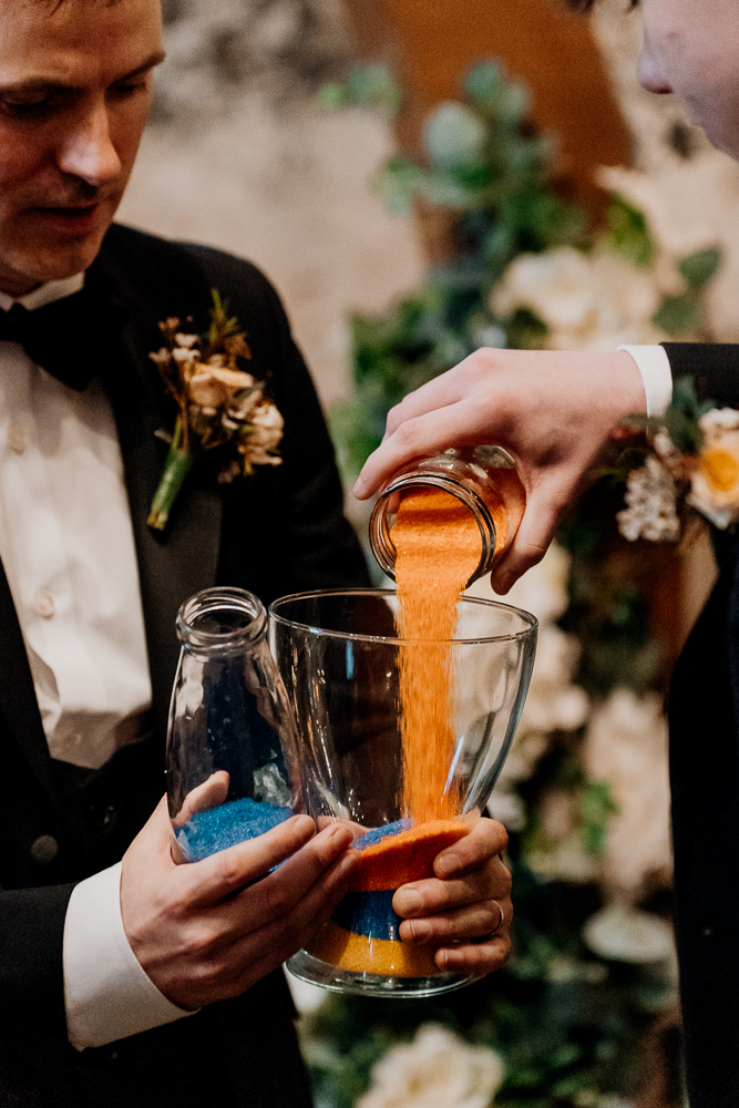 A man pouring a drink into a glass