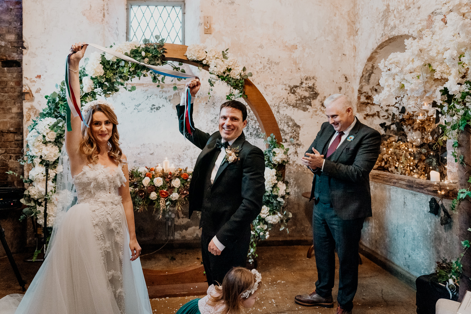 A bride and groom walking down the aisle