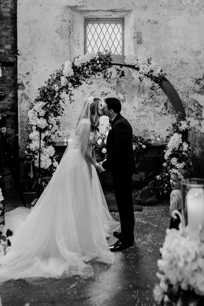 A bride and groom kissing