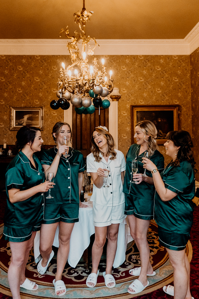 A group of women in green dresses