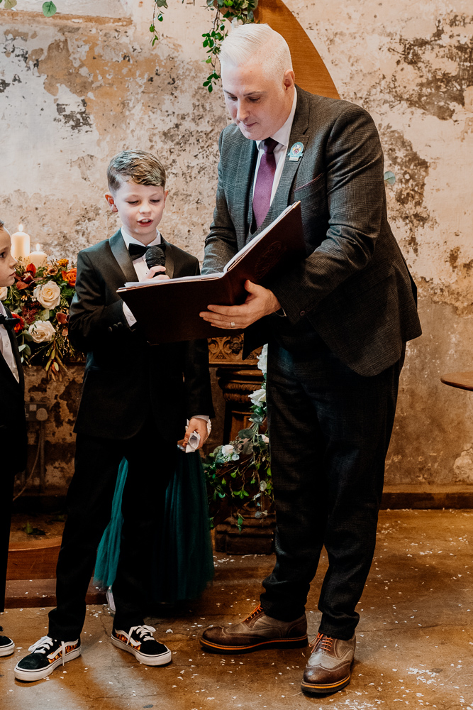 A man and a boy holding a book