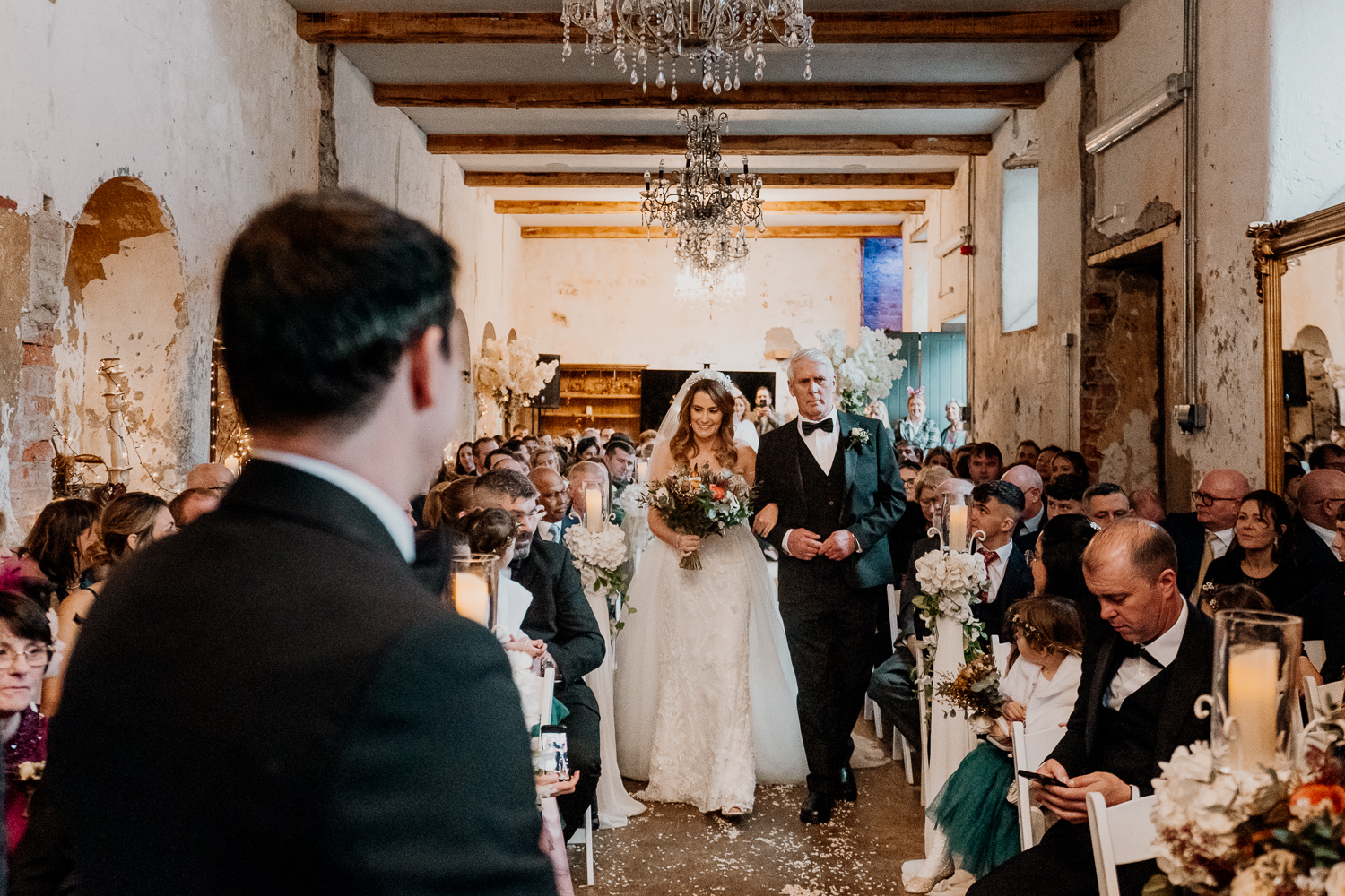 A man and woman walking down a aisle