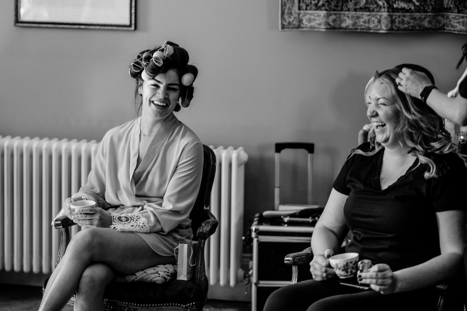 A couple of women sitting in chairs