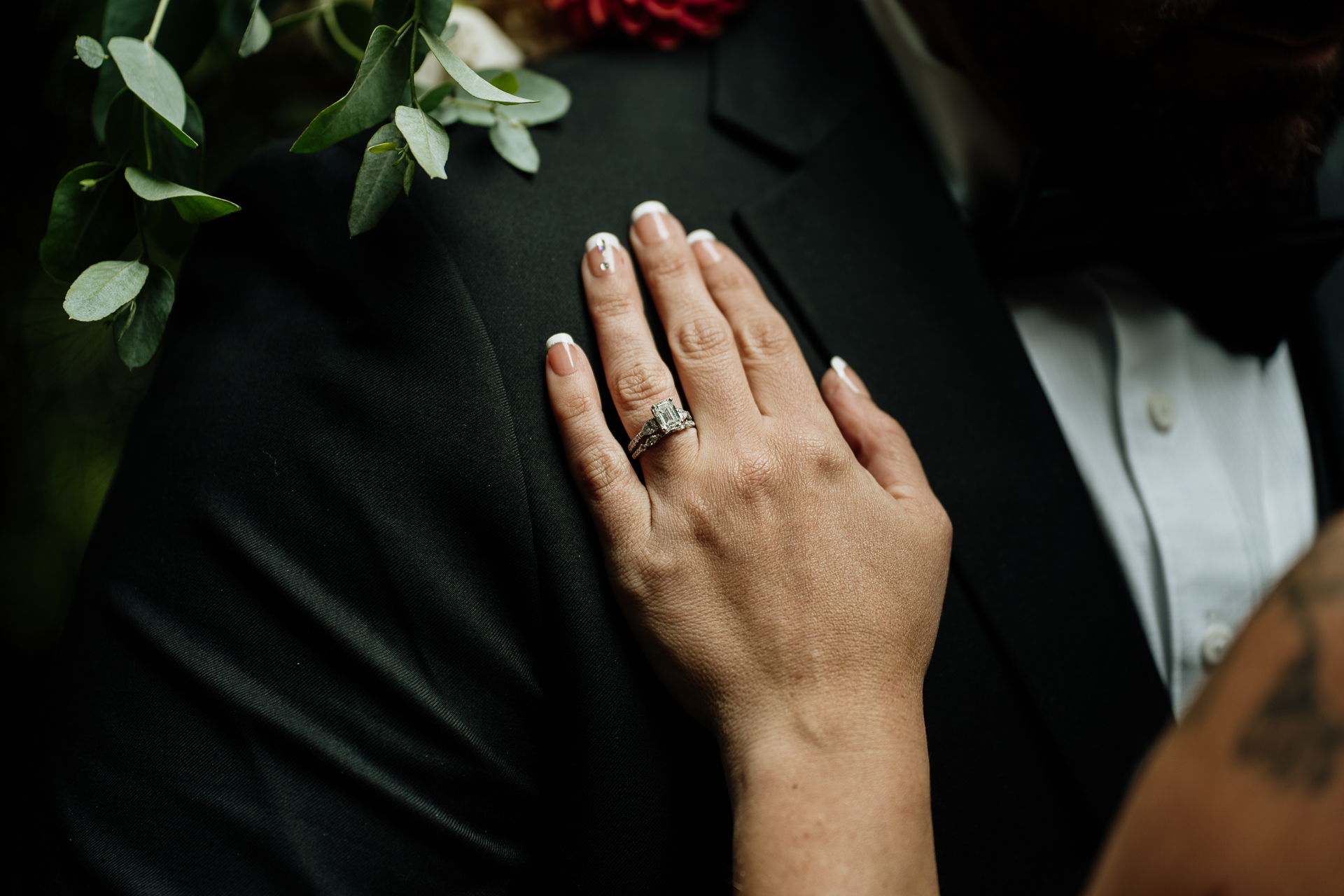 A person's hand with a ring on it